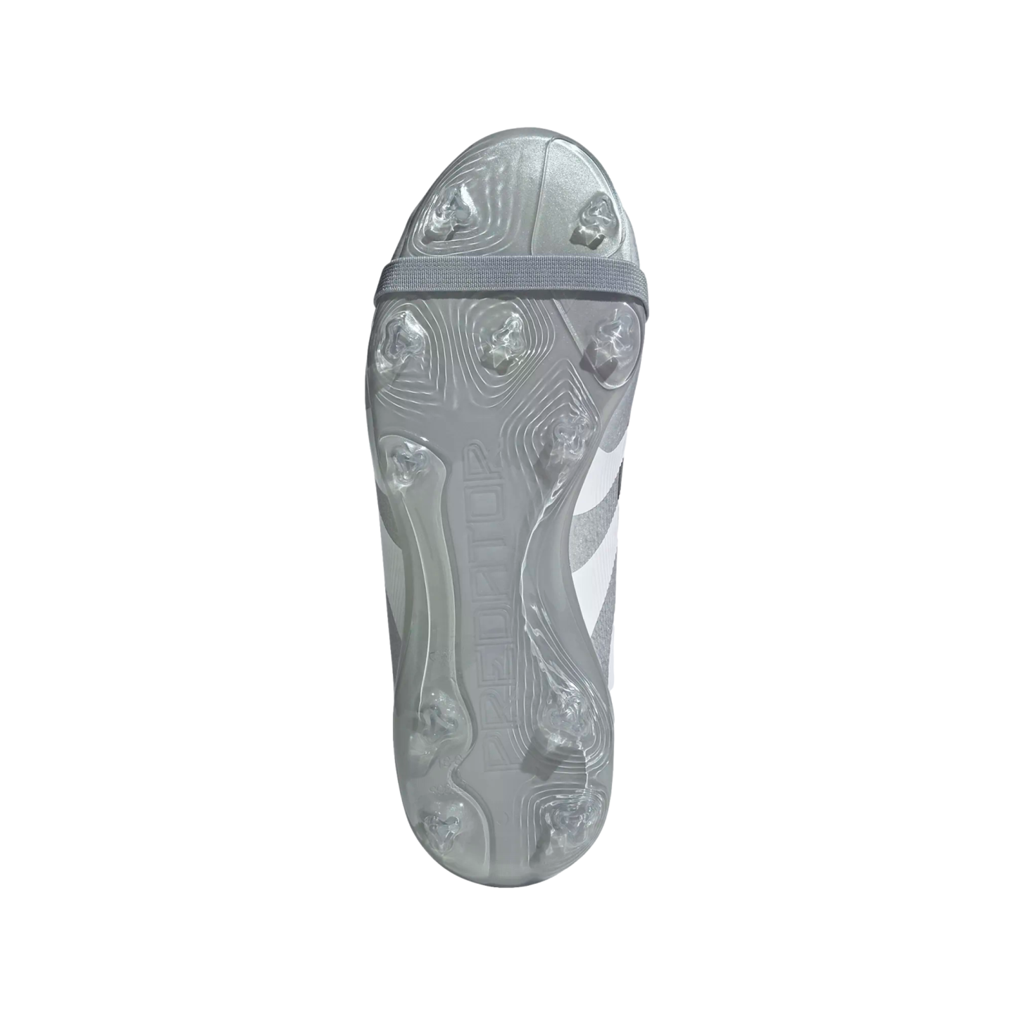 Bottom view of a silver Adidas Predator soccer cleat featuring transparent studs and an elastic strap across the forefoot.