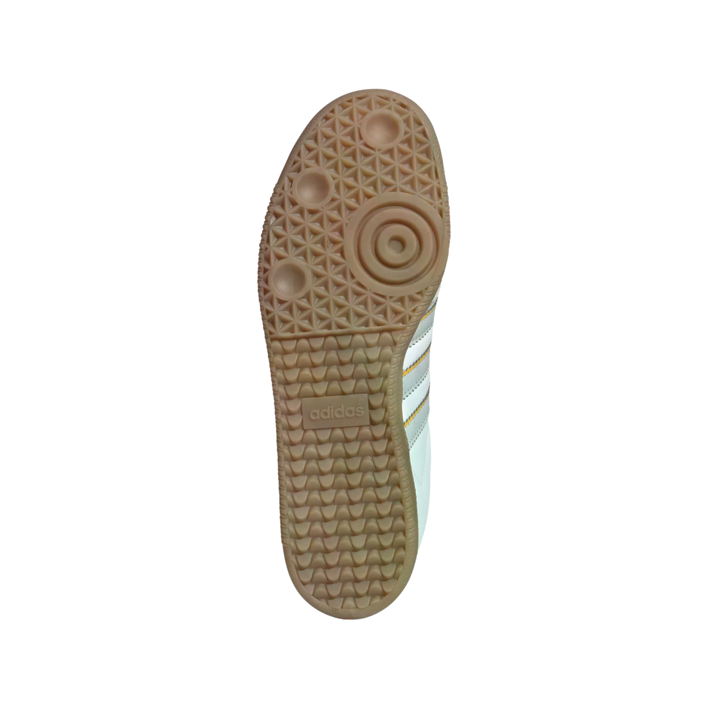 Bottom view of a light brown gum rubber sole on an Adidas sneaker showing a patterned tread and central logo against a white background.