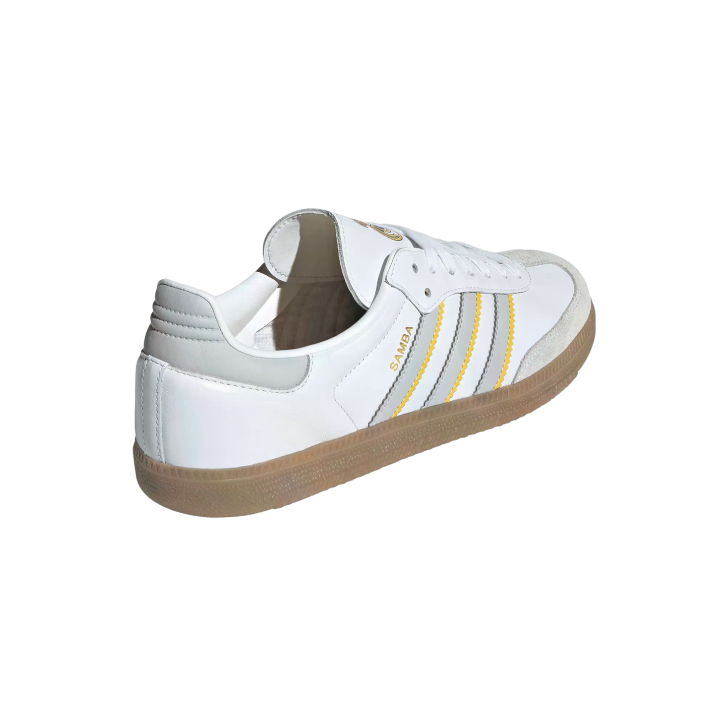 White Adidas Samba sneaker with grey and yellow serrated stripes and a gum rubber sole, shown from a rear side angle against a white background.