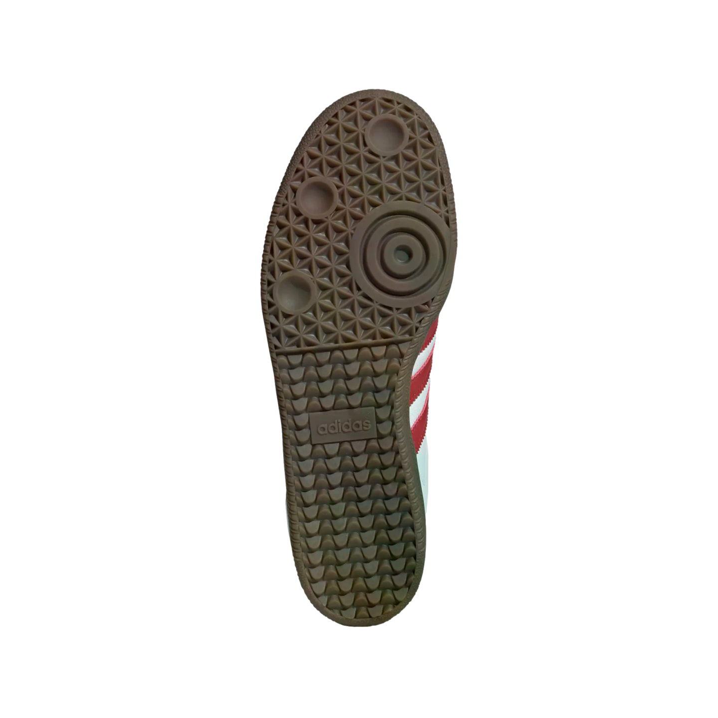 A gum rubber Adidas sneaker outsole with a textured tread and logo, set against a black background. White and red stripes are partially visible on the side.