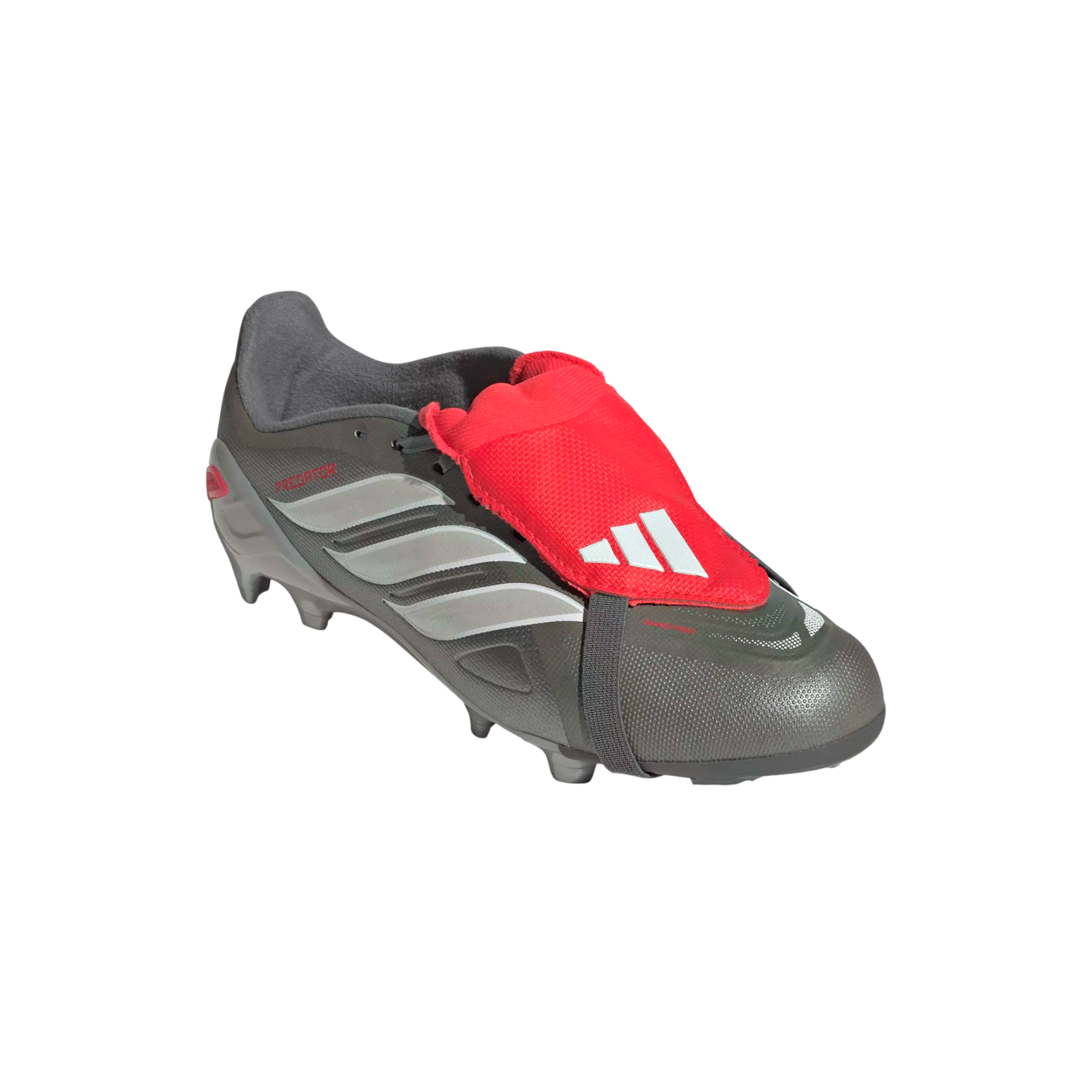 Dark grey Adidas Predator soccer cleat with silver stripes and a bright red fold-over tongue secured by a strap, isolated on a black background.