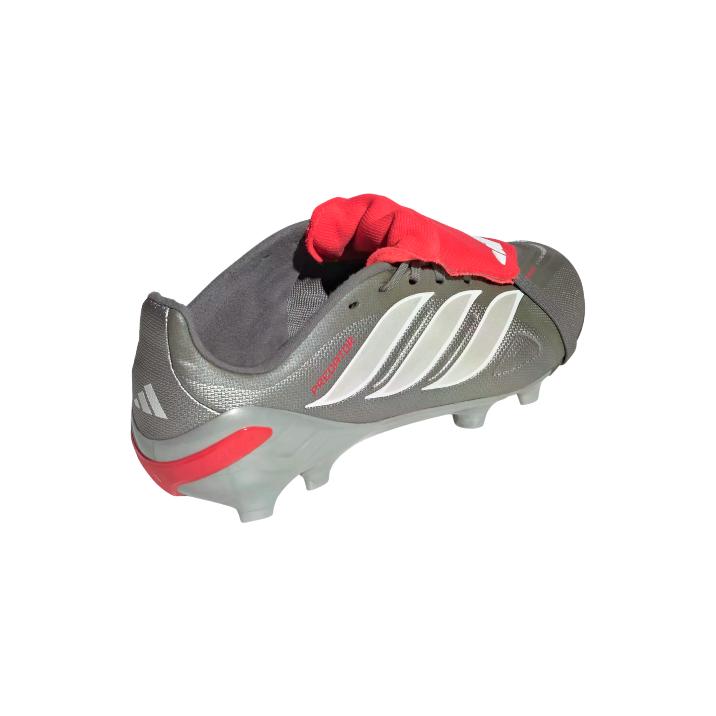A metallic gray Adidas Predator soccer cleat with three white stripes and a red fold-over tongue, isolated on a black background.