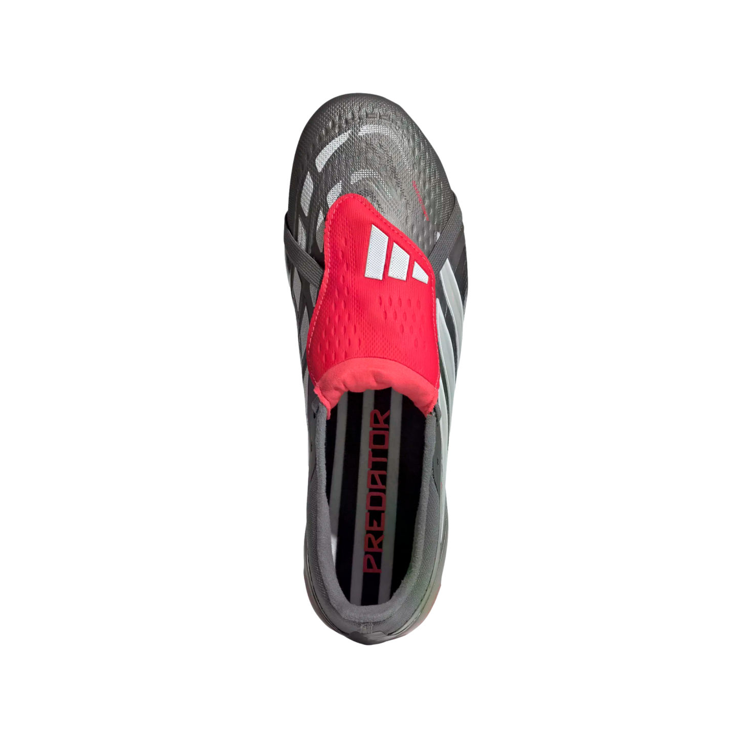 Top-down view of a grey and black Adidas Predator soccer cleat with a red fold-over tongue and white logo. The name "PREDATOR" is visible on the insole.