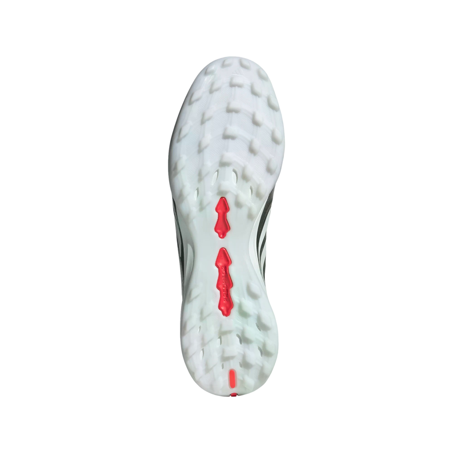 White and translucent outsole of an Adidas Predator soccer shoe with many small studs and red brand accents, centered on a black background.