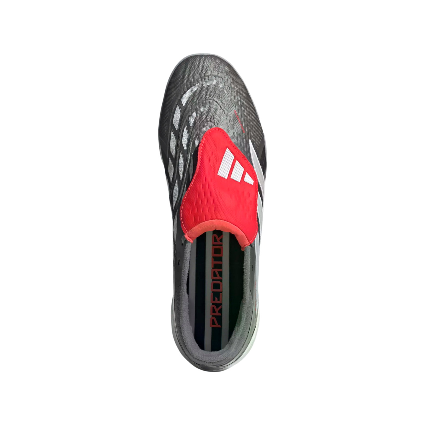 Top-down view of a grey Adidas Predator soccer shoe with a prominent red fold-over tongue and white three-stripe logo.