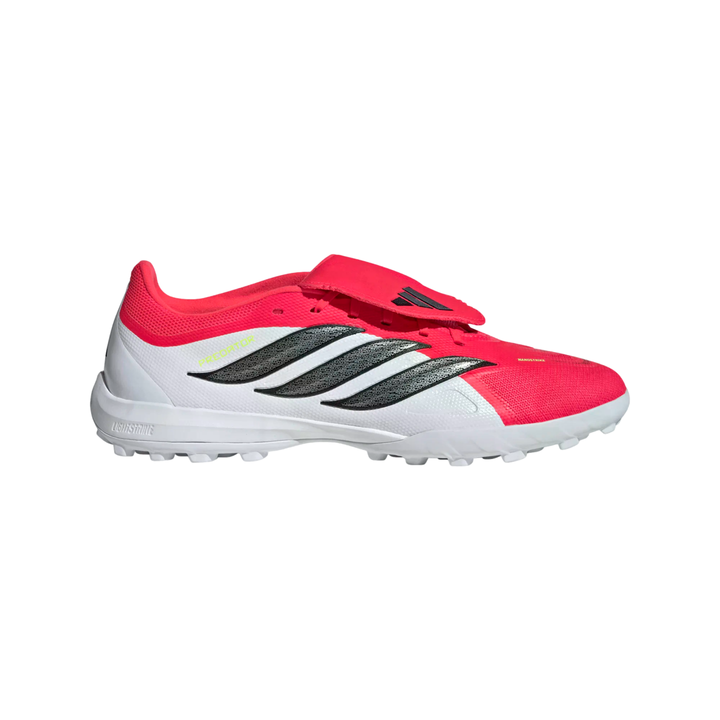 Side profile of a red and white Adidas Predator soccer shoe with black stripes and a studded turf outsole, set against a black background.