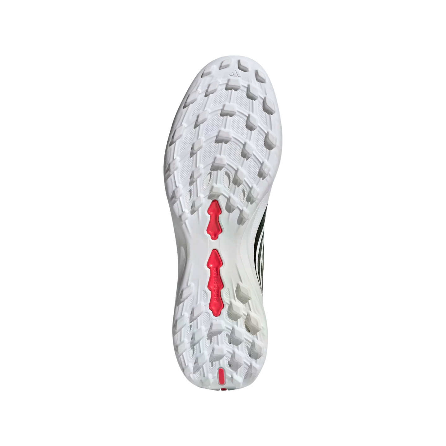 Underside view of a white Adidas Predator soccer cleat featuring a studded turf outsole with red accents and the Adidas logo.