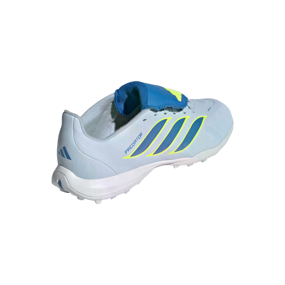 A light blue Adidas Predator turf soccer shoe shown from a three-quarter rear view, featuring dark blue stripes with neon yellow outlines and a blue fold-over tongue.