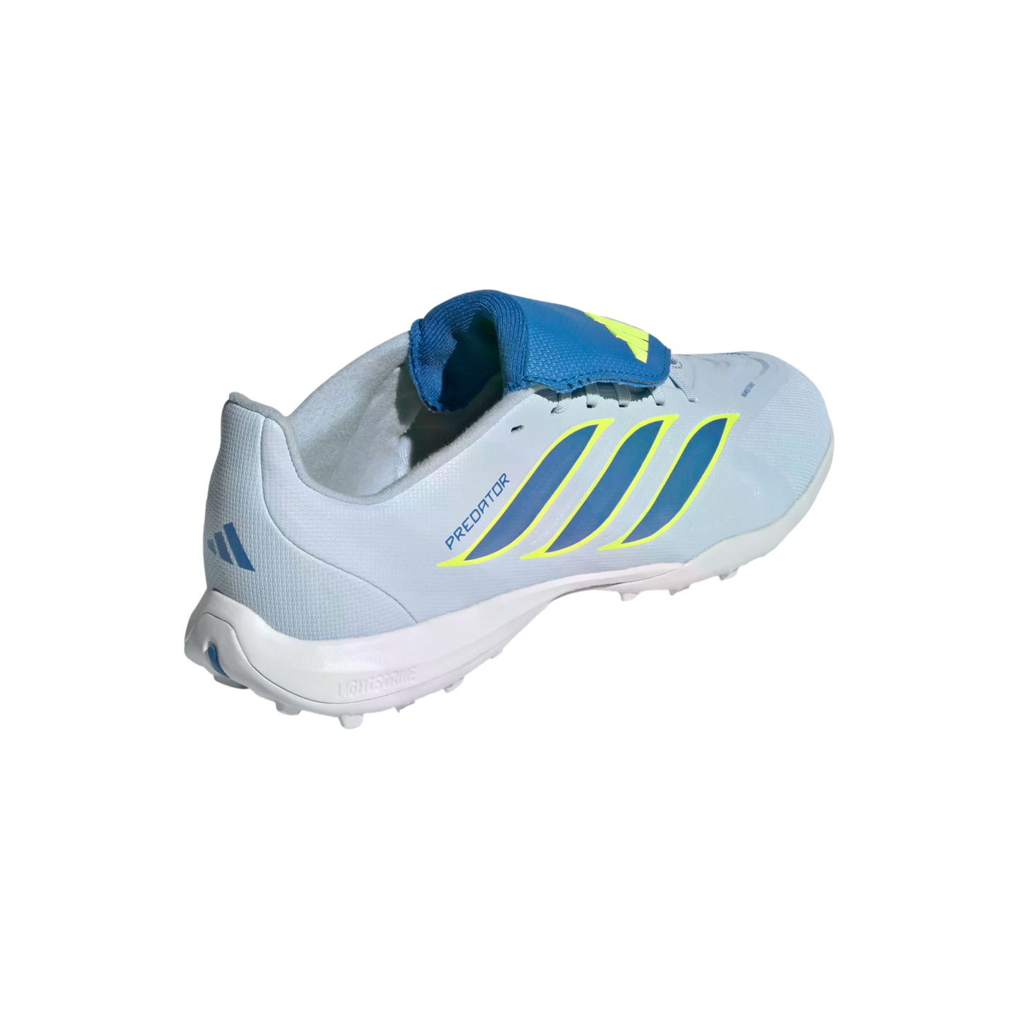 A light blue Adidas Predator turf soccer shoe shown from a three-quarter rear view, featuring dark blue stripes with neon yellow outlines and a blue fold-over tongue.