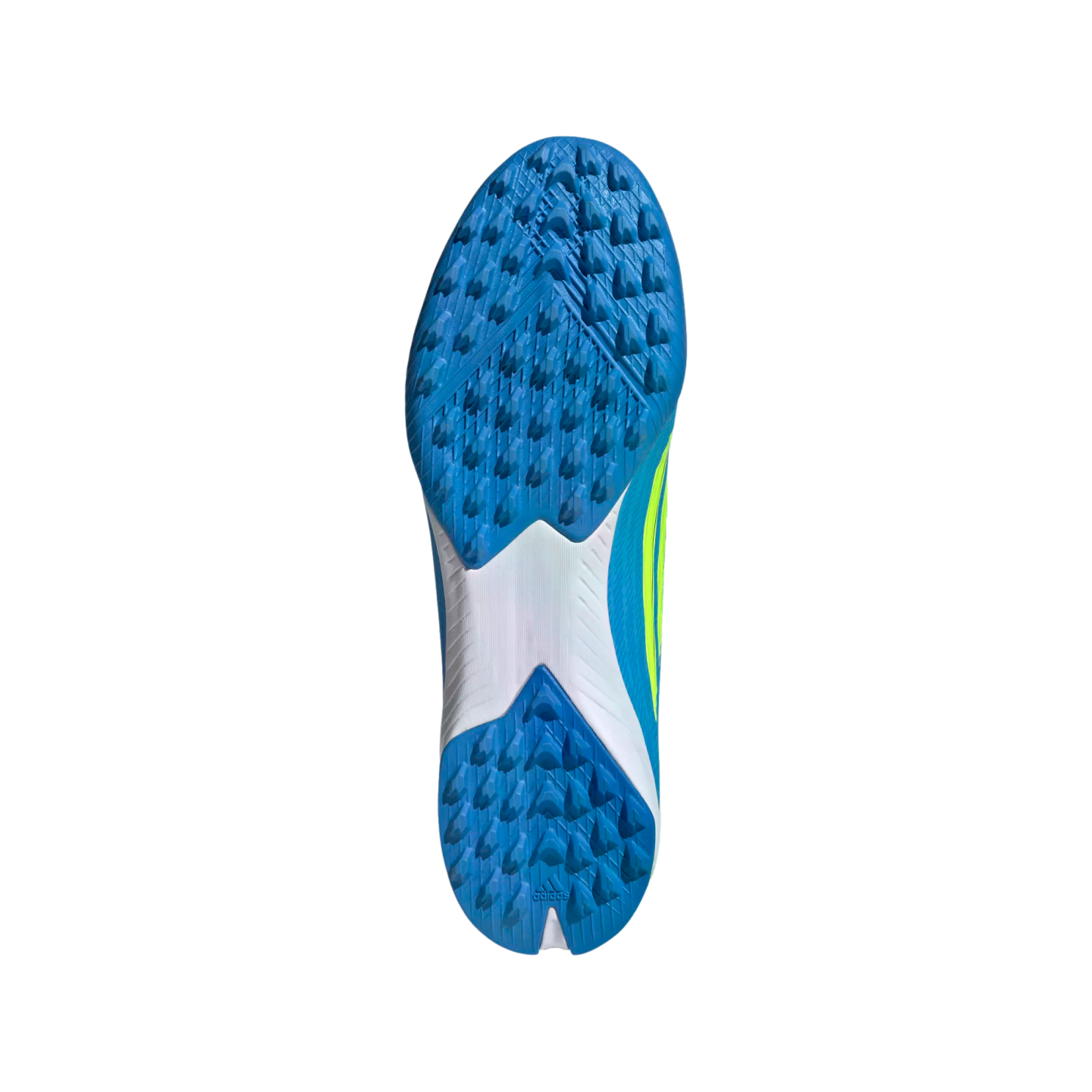The bottom view of a blue and white Adidas turf soccer shoe features a blue outsole with many small, pointed rubber studs, a white midfoot section, and a black background.