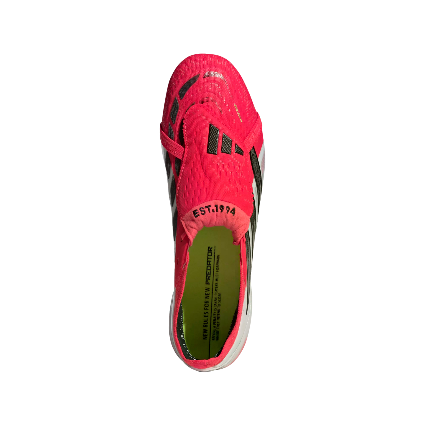 Top-down view of a bright pink Adidas Predator football boot with a fold-over tongue and lime green insole, set against a solid black background.