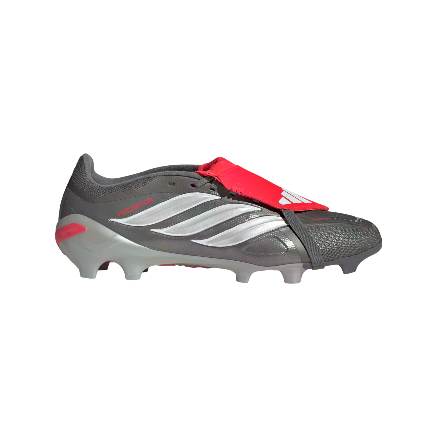 A grey Adidas Predator football boot with three white stripes and a red fold-over tongue, shown in a side profile on a black background.