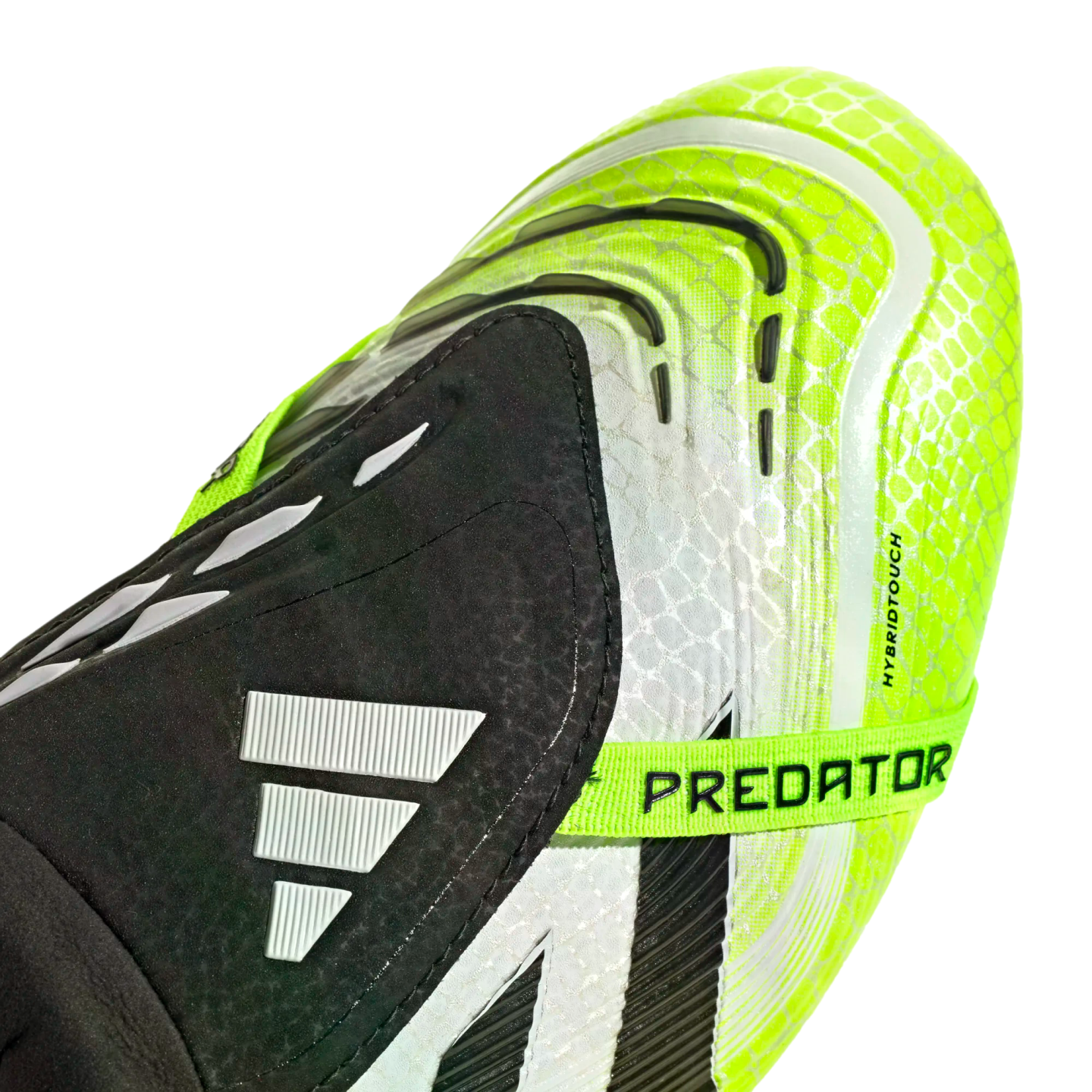 Close-up of a neon yellow and black Adidas Predator football boot with a textured upper and a branded "PREDATOR" strap.