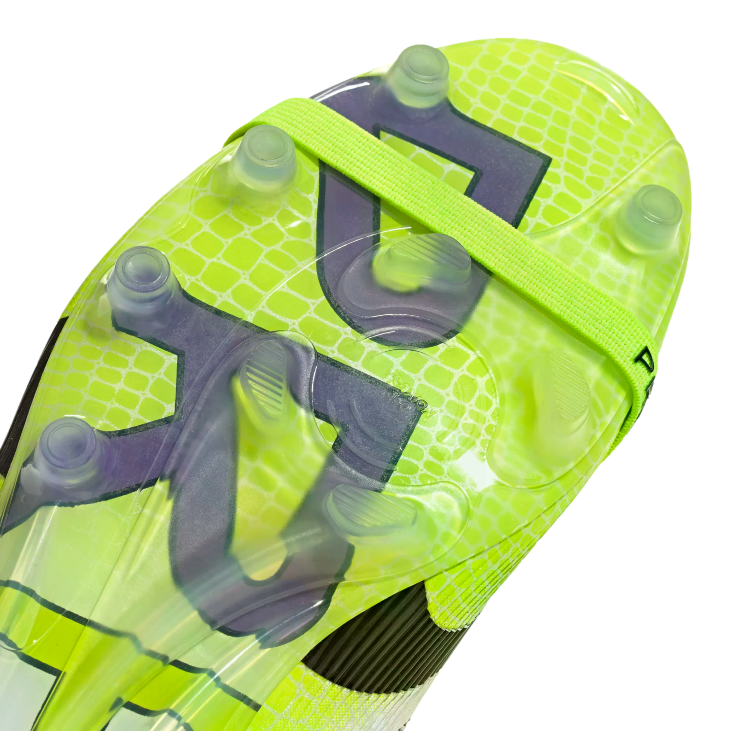 Close-up of a neon yellow soccer cleat's soleplate with clear studs, featuring a lime green reptile skin pattern, purple accents, and a bright green elastic strap.