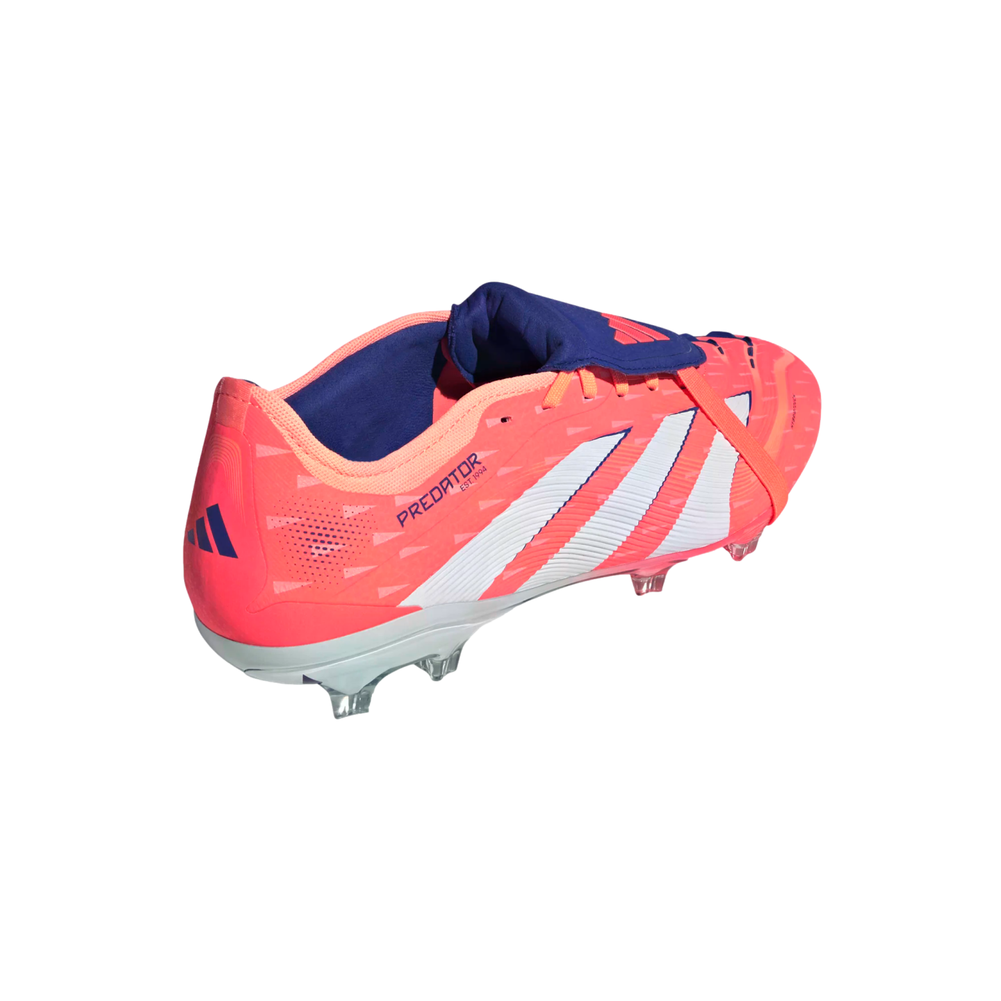 A pink and coral Adidas Predator soccer cleat with white stripes and a dark blue fold-over tongue, shown from a rear side angle against a solid black background.