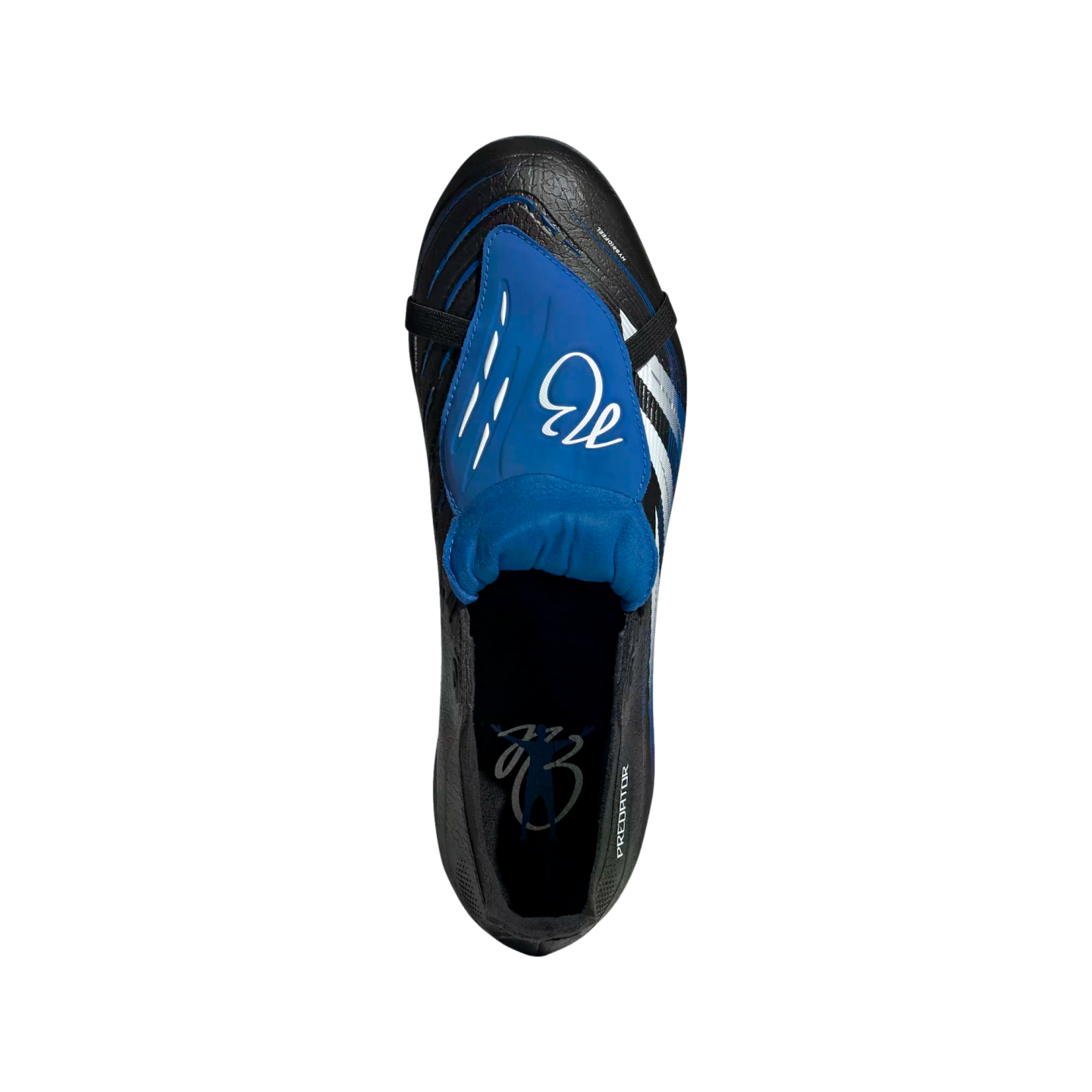 A top-down view of a black and blue Adidas Predator soccer cleat with a large blue fold-over tongue featuring a white signature logo.