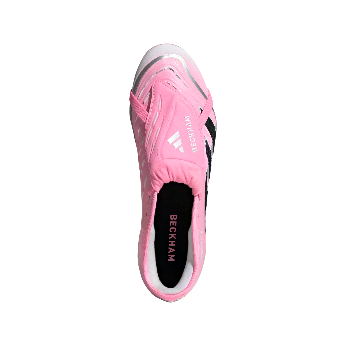 Top-down view of a pink Adidas Predator soccer cleat with "BECKHAM" branding on the fold-over tongue and insole, featuring white and black accents.