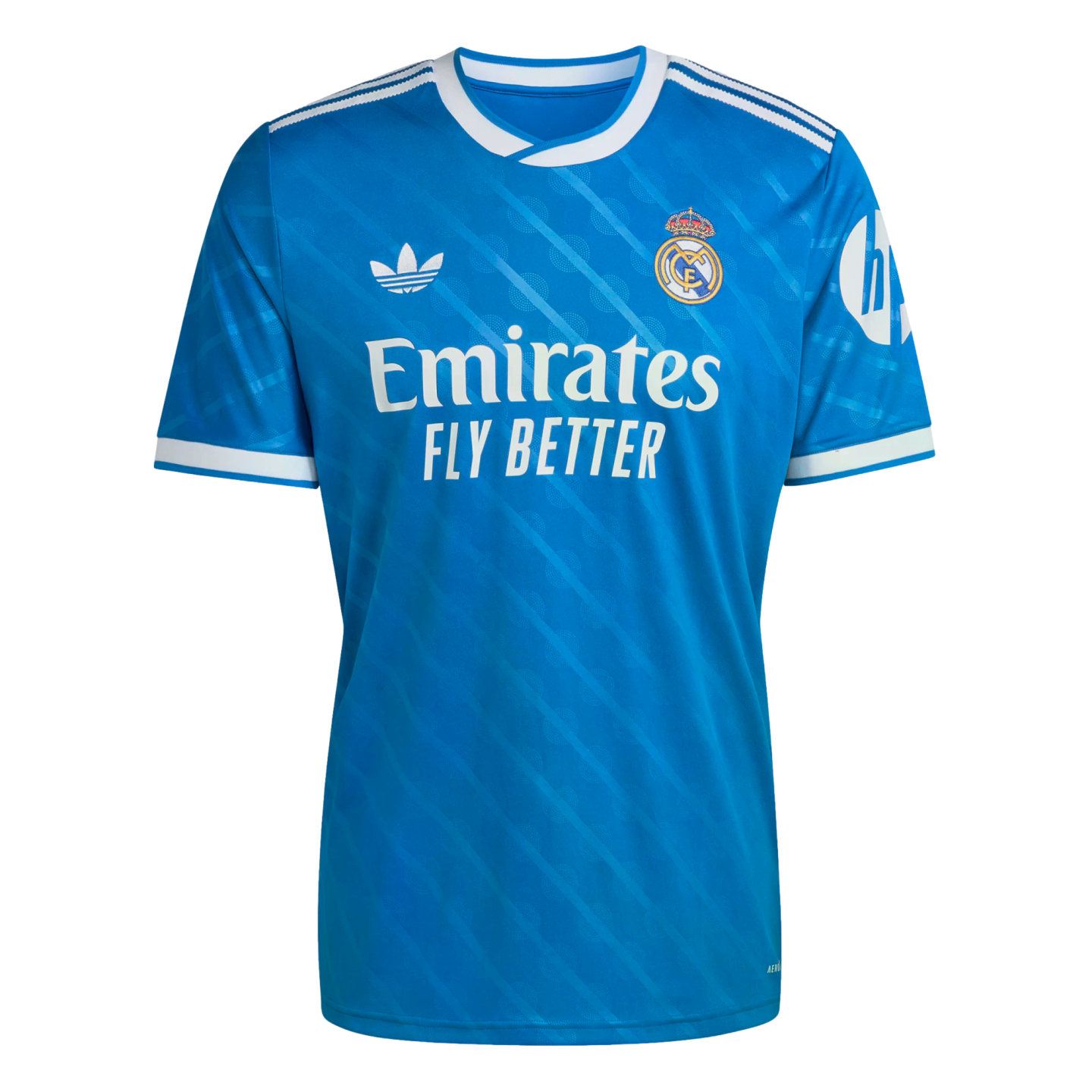 Bright blue Real Madrid soccer jersey with white Adidas trefoil logo, club crest, and "Emirates FLY BETTER" sponsor across the chest.