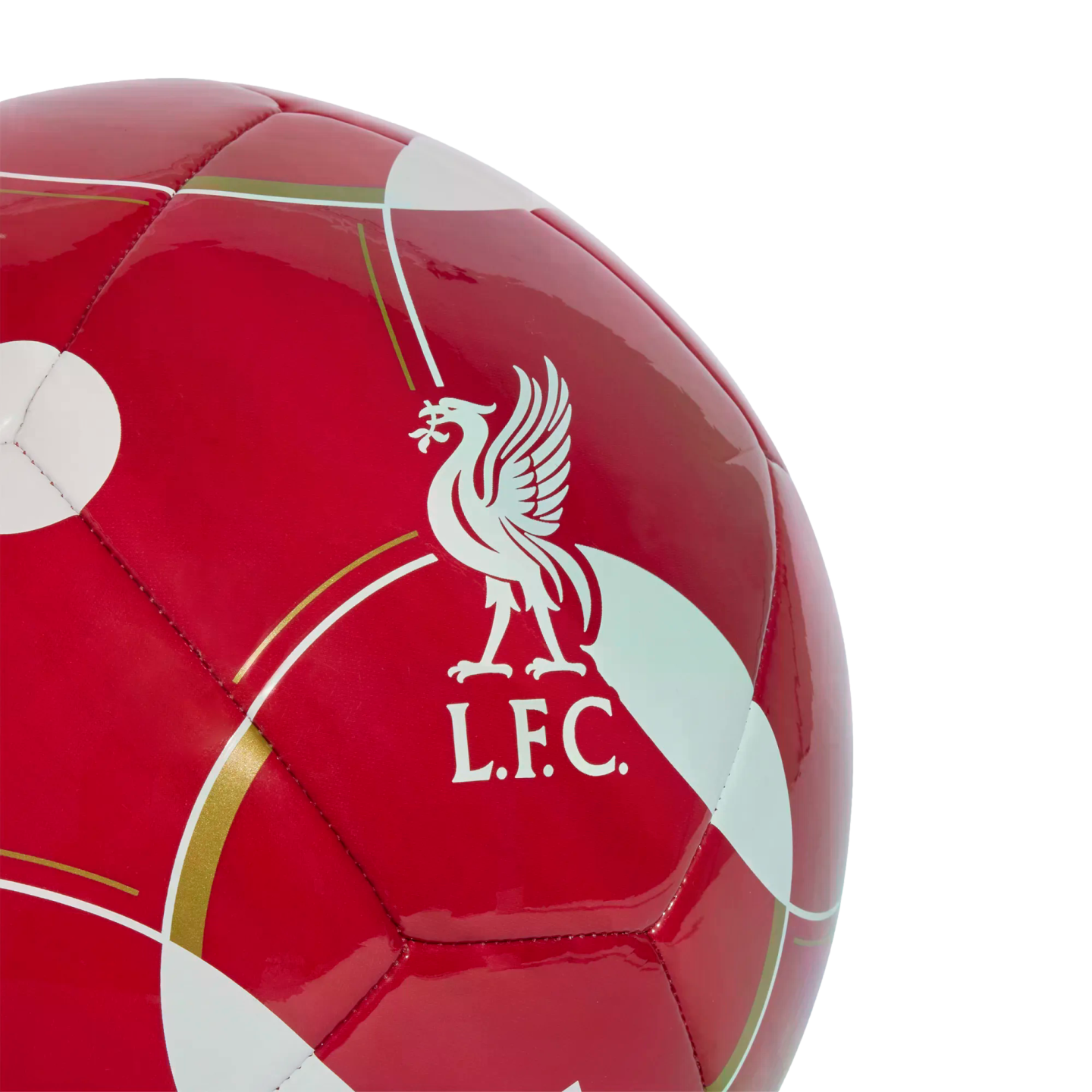 A glossy red soccer ball featuring the white Liverpool FC crest and decorative gold and white curved patterns.