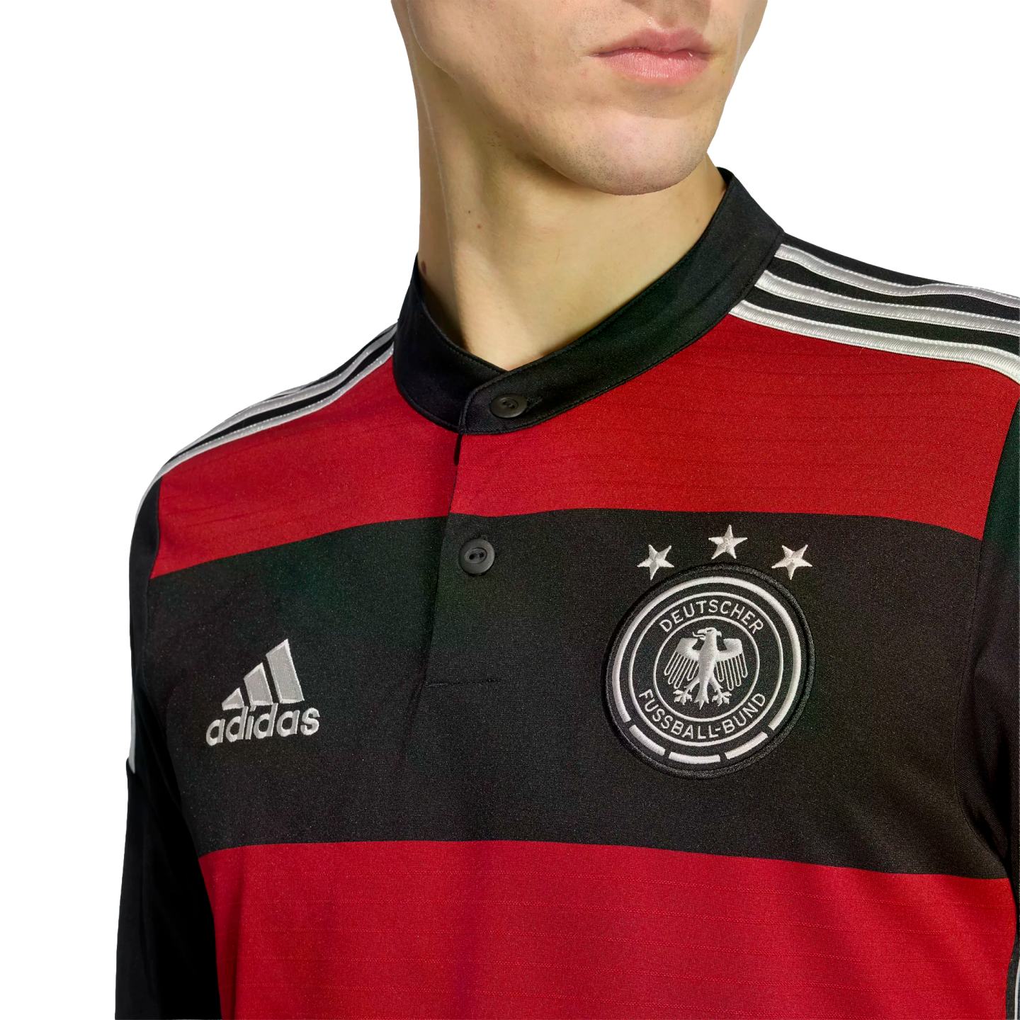 Close-up of a person wearing a red and black striped Germany football jersey featuring the Adidas logo and the DFB crest with three stars.