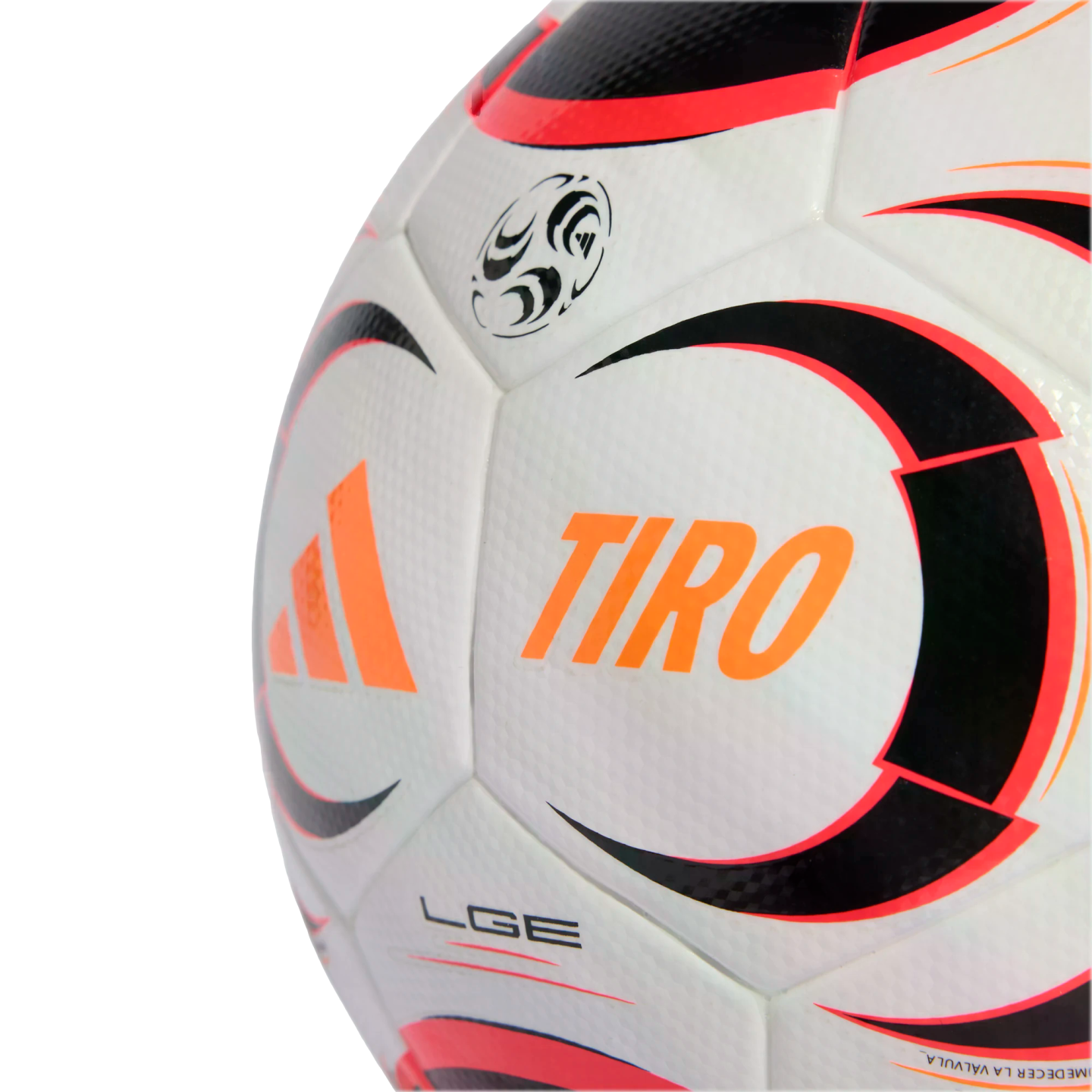 A close-up of a white Adidas Tiro soccer ball with orange, black, and red graphics on its textured surface against a black background.