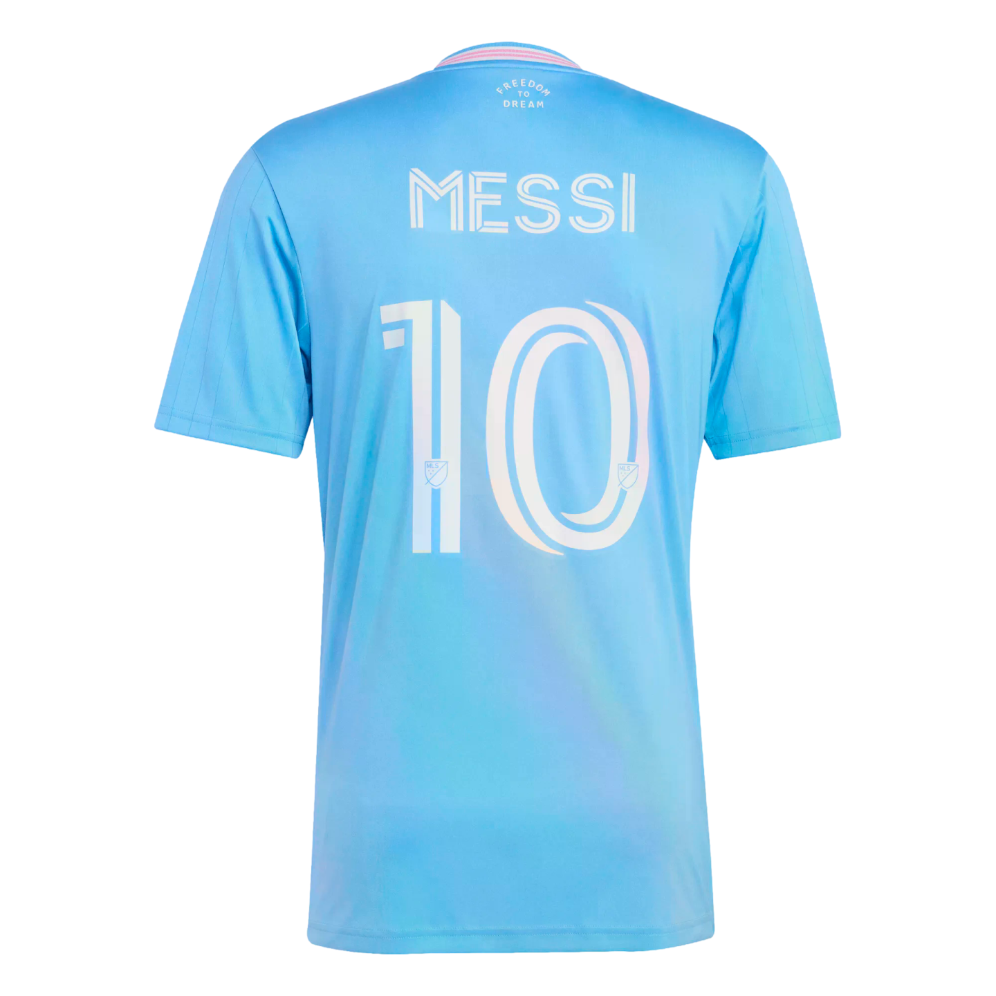 Back view of a light blue soccer jersey with "MESSI" and the number "10" in white stylized font. The collar has pink trim and "FREEDOM TO DREAM" printed below it.