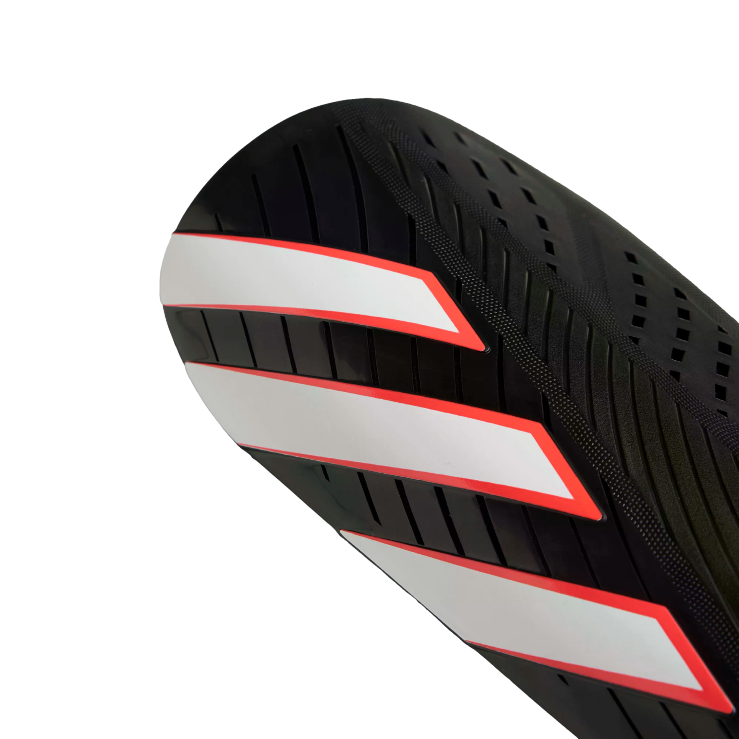 Close-up of a black athletic shin guard featuring three diagonal white stripes with red outlines.