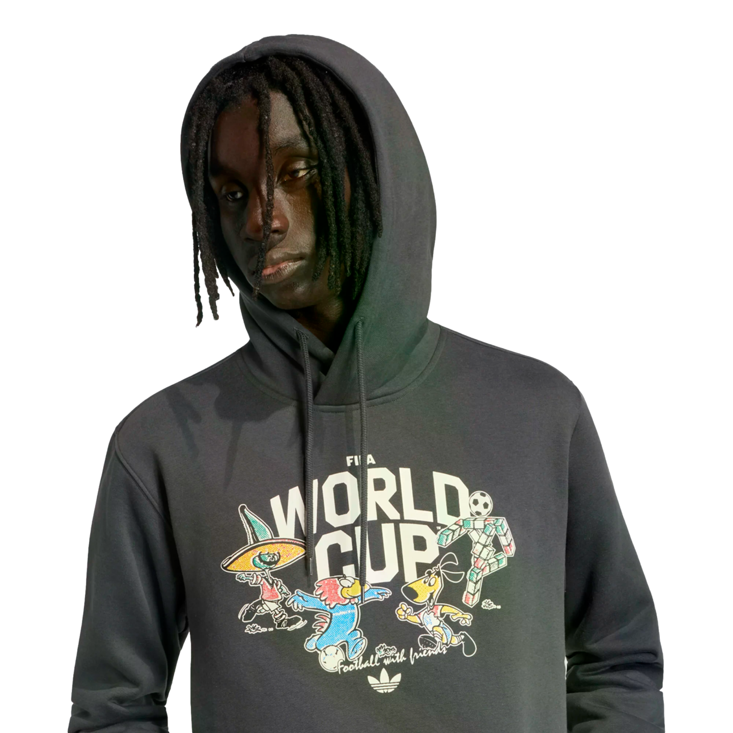 A young man with dreadlocks wearing a dark grey Adidas FIFA World Cup hoodie with colorful cartoon graphics on the front.