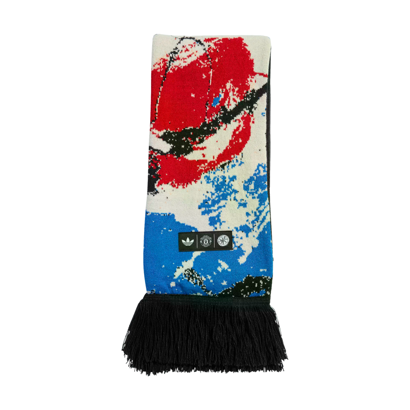 Manchester United x Adidas Stone Roses scarf featuring abstract red, white, and blue graphics, black fringe, and logos for Adidas, the club, and the band.