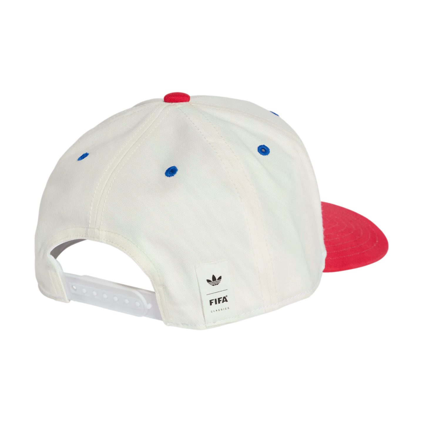 A rear view of a white six-panel baseball cap with blue embroidered eyelets and a red top button. A portion of the red brim is visible on the right side. It features a white snapback closure and a small white tag on the back with the Adidas trefoil logo a