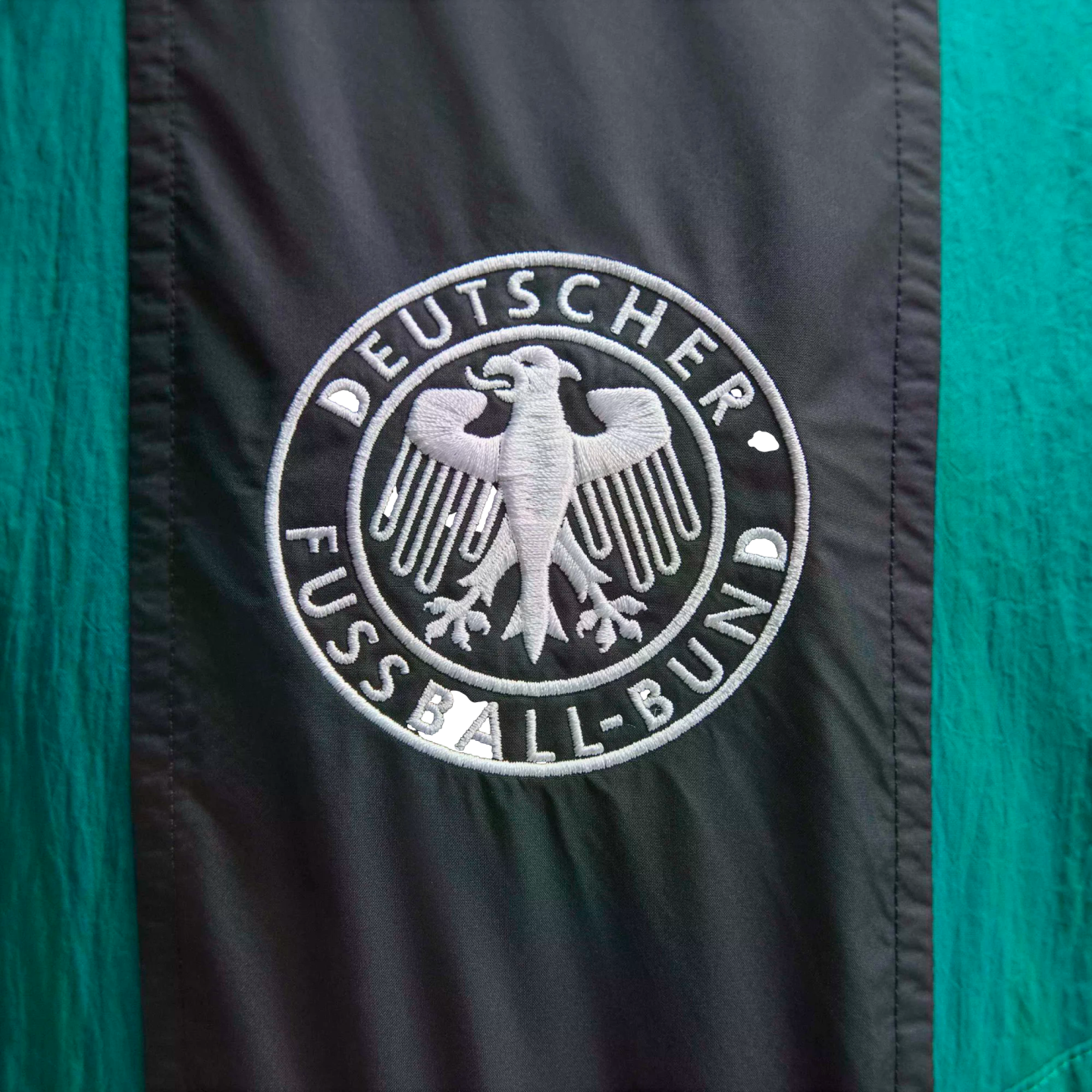 Embroidered Deutscher Fußball-Bund (DFB) crest with a white eagle on black and green fabric.