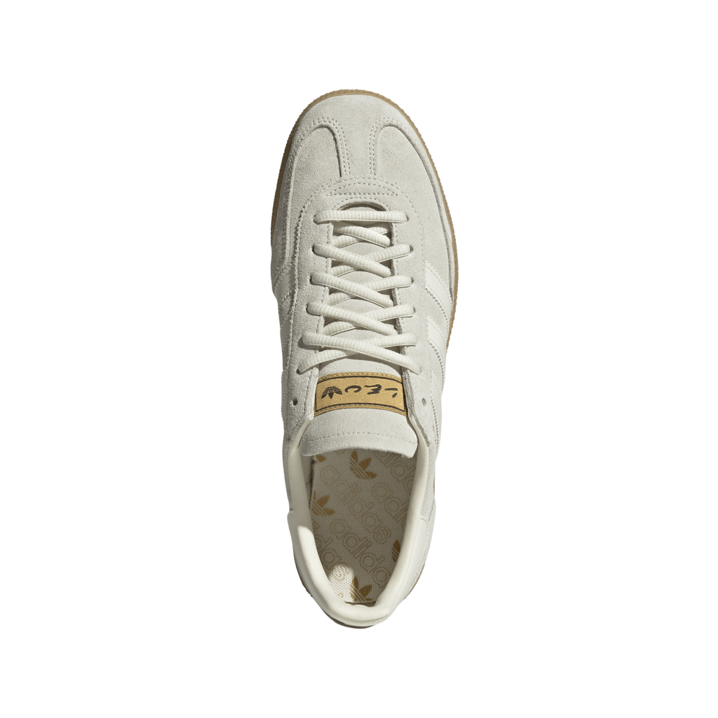 A top-down view of a light gray suede Adidas sneaker with matching laces and a gum rubber outsole, centered on a white background.