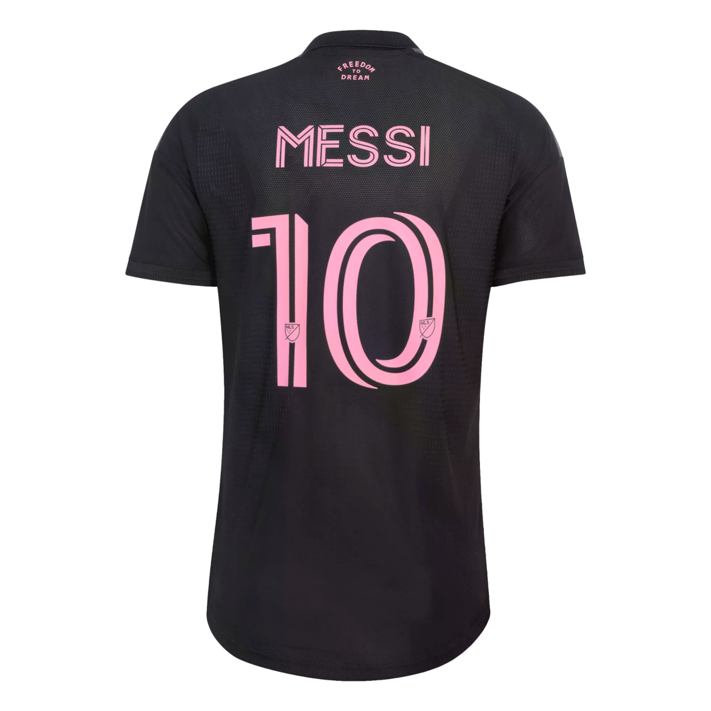 The back of a black soccer jersey with the name "MESSI" and the number "10" printed in a large, stylized pink font. Small pink text at the top reads "FREEDOM TO DREAM."