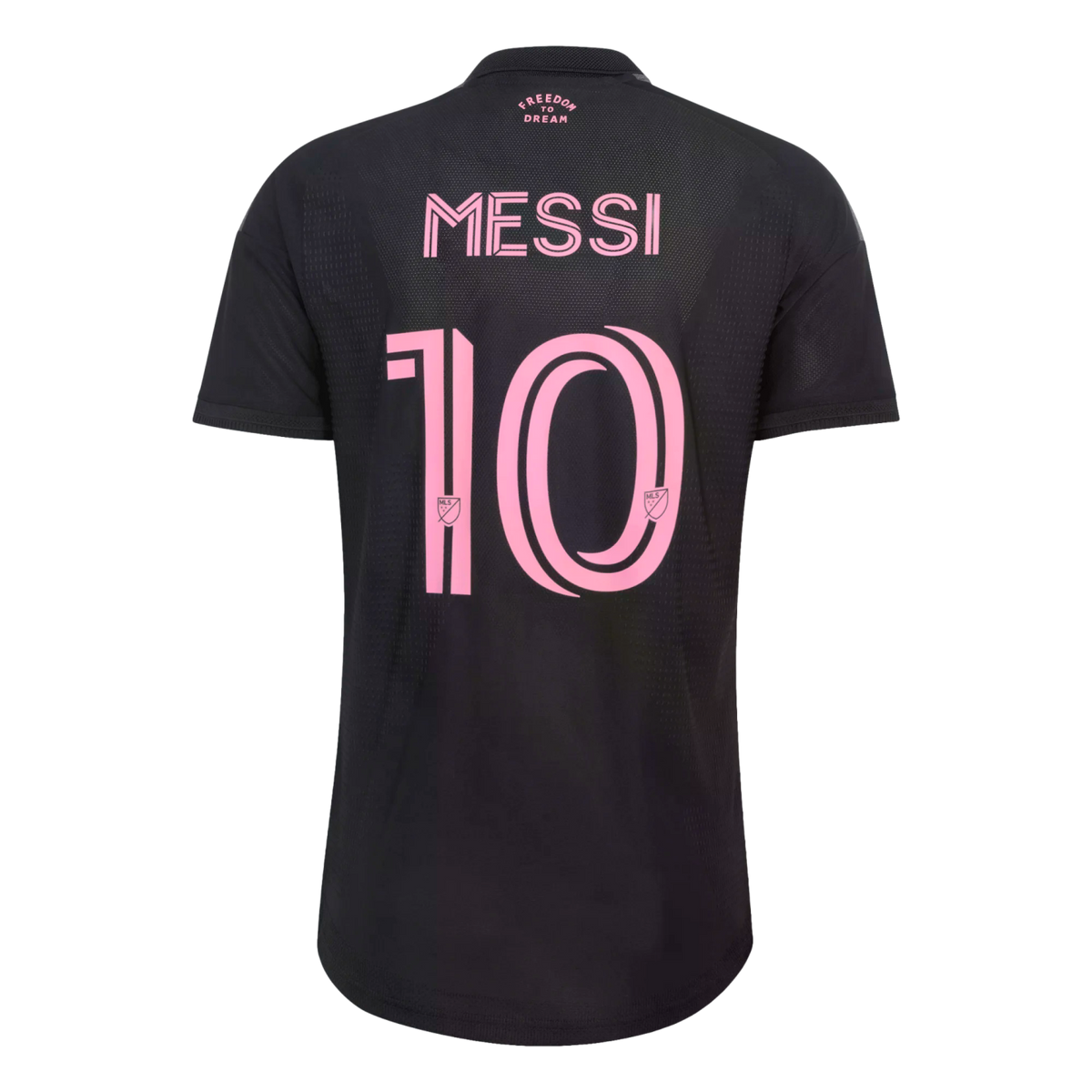 The back of a black soccer jersey with the name "MESSI" and the number "10" printed in a large, stylized pink font. Small pink text at the top reads "FREEDOM TO DREAM."