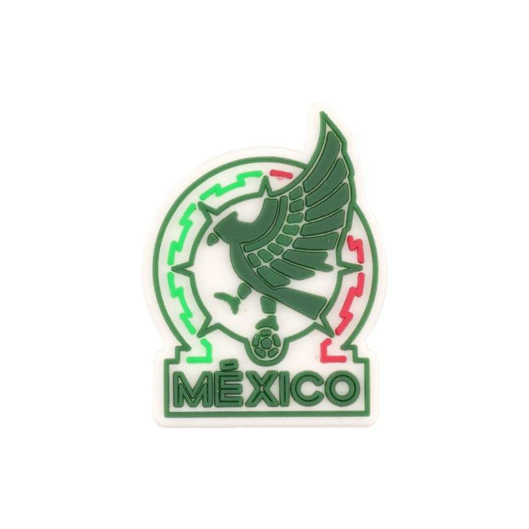 Rubber shoe charm of the Mexico national football team logo, featuring a stylized green eagle and the word "MÉXICO" at the bottom.