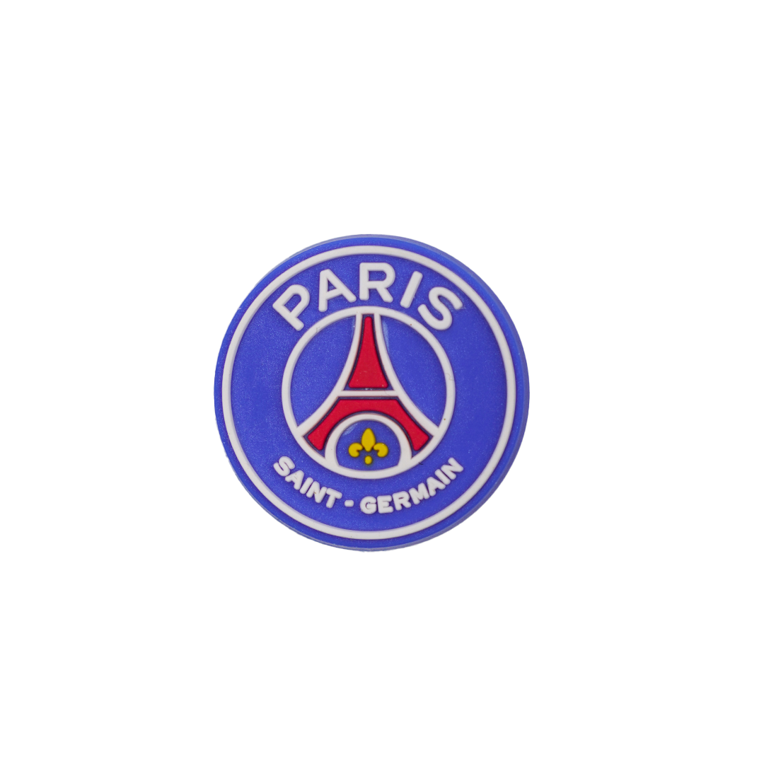 A circular Soccer Croc Charm featuring the blue, red, and white Paris Saint-Germain (PSG) football club logo.
