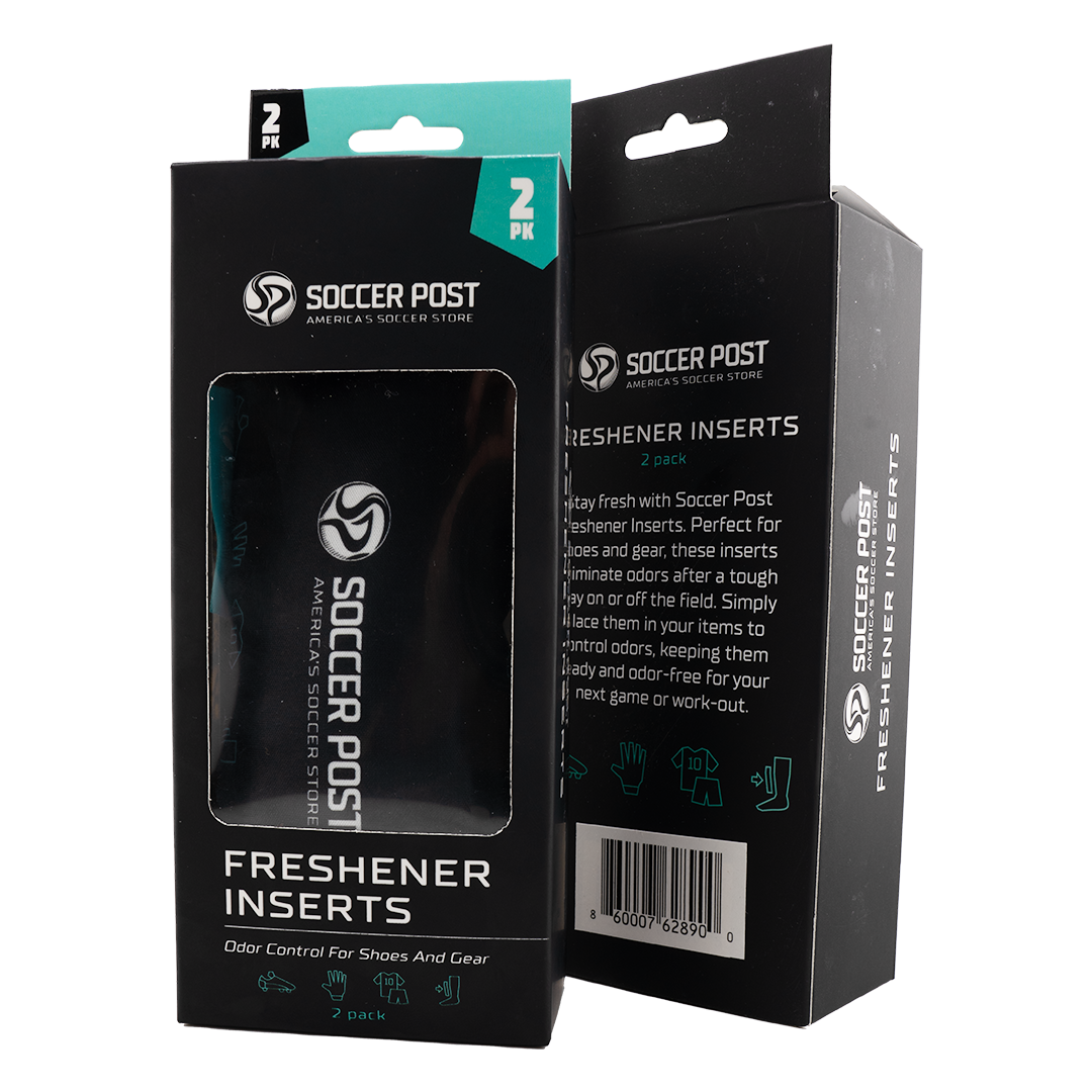 Two black boxes of Soccer Post Freshener Inserts are shown side-by-side against a white background. One box is positioned to show the front with a clear window revealing a black insert inside, while the other shows the side and back with product descripti