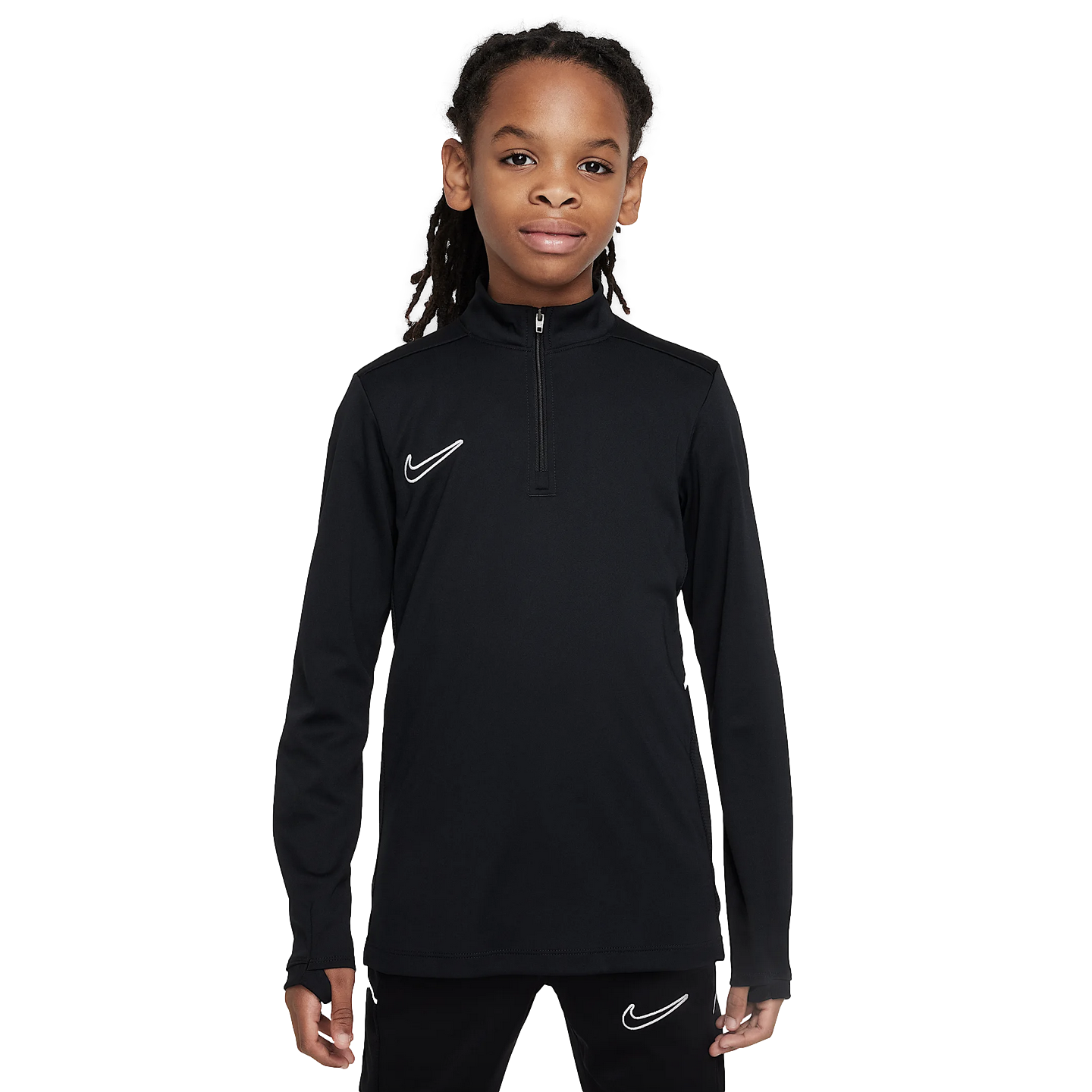 A youth in a black Nike long-sleeved quarter-zip athletic top and matching pants against a plain white background.