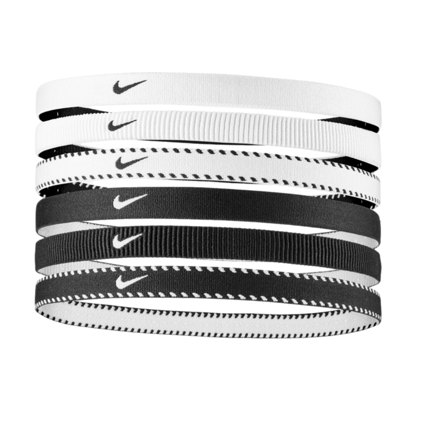 A stack of six Nike elastic headbands in various black and white designs, featuring solid, ribbed, and dashed patterns.
