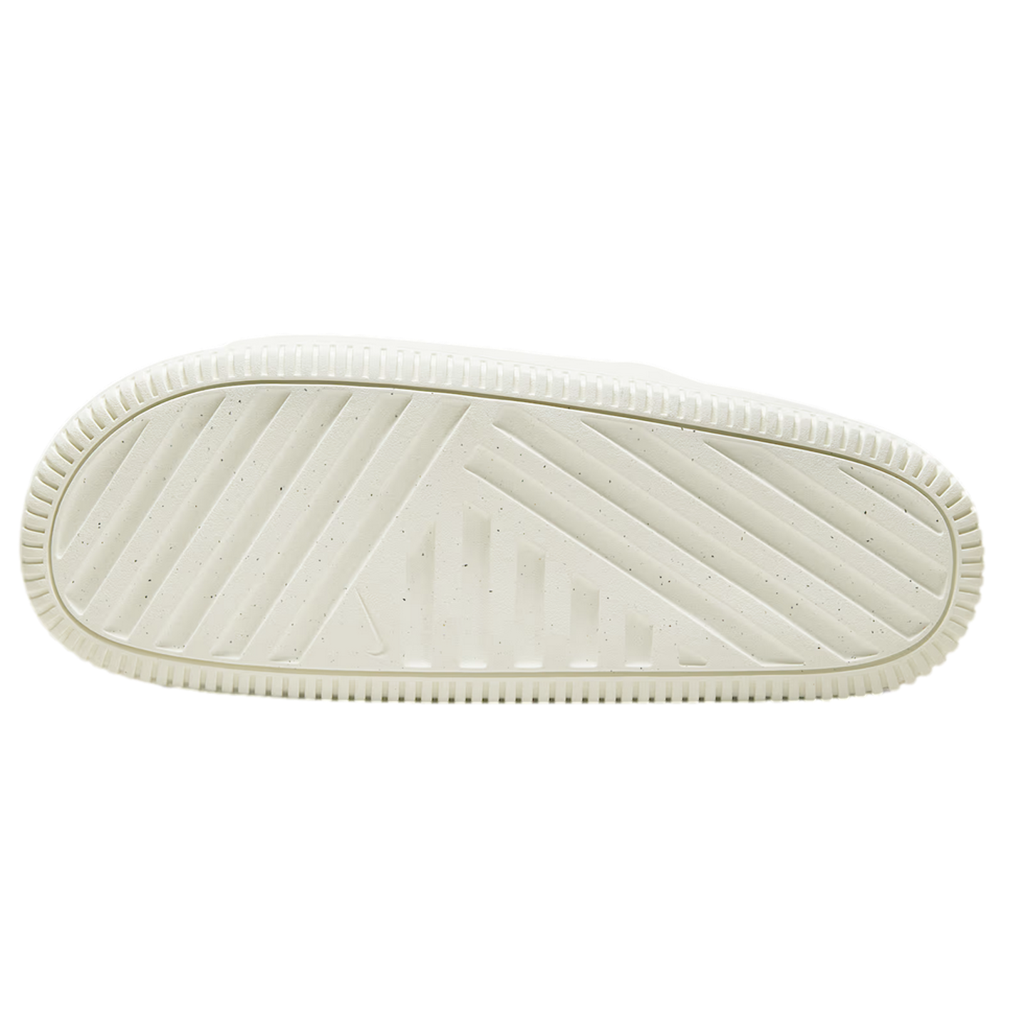 The sole of an off-white Nike slide featuring a textured geometric tread pattern with diagonal and horizontal grooves.