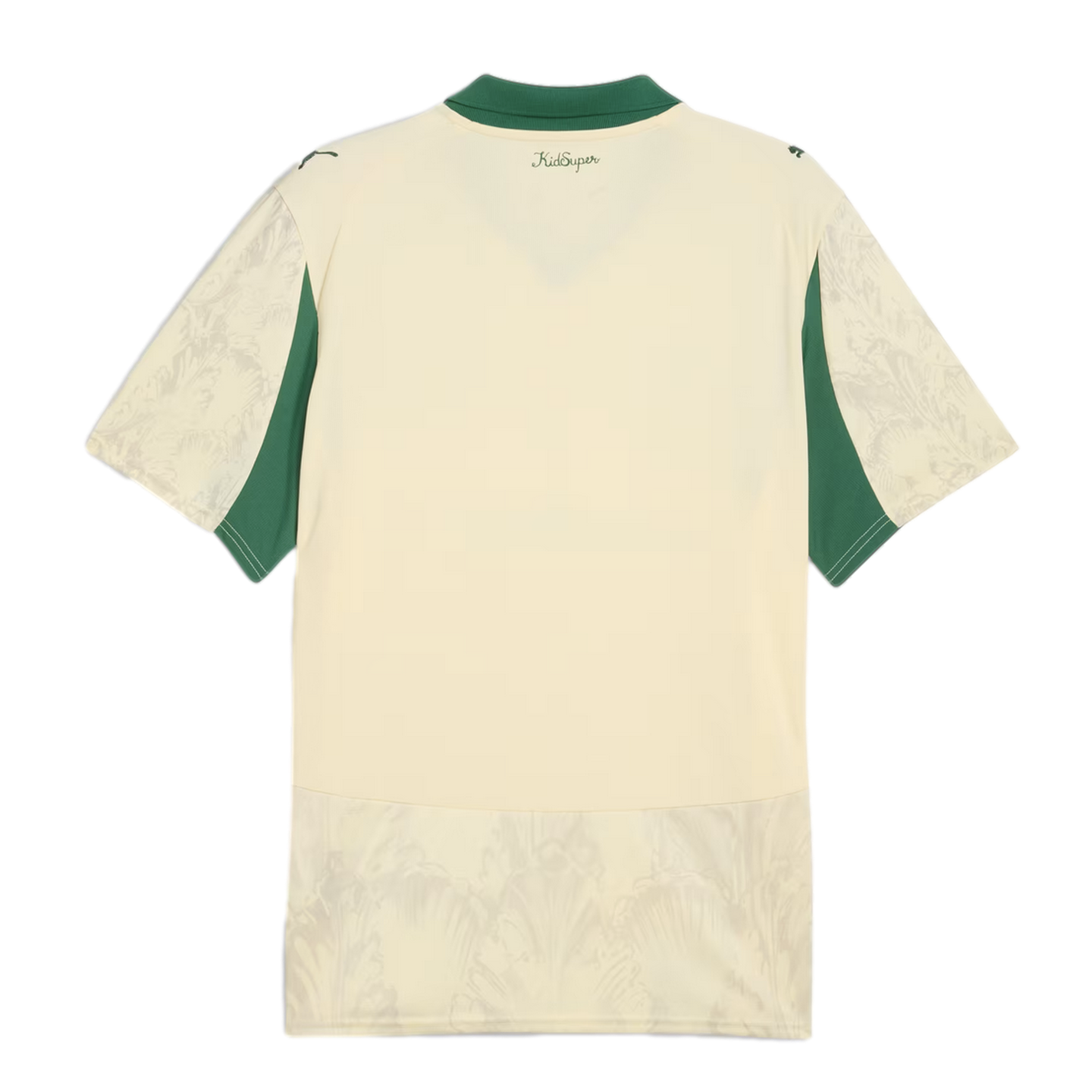 Back view of a cream short-sleeved jersey with a green collar and side panels. Features a tonal floral pattern on the sleeves and hem, and "KidSuper" text centered below the neckline.