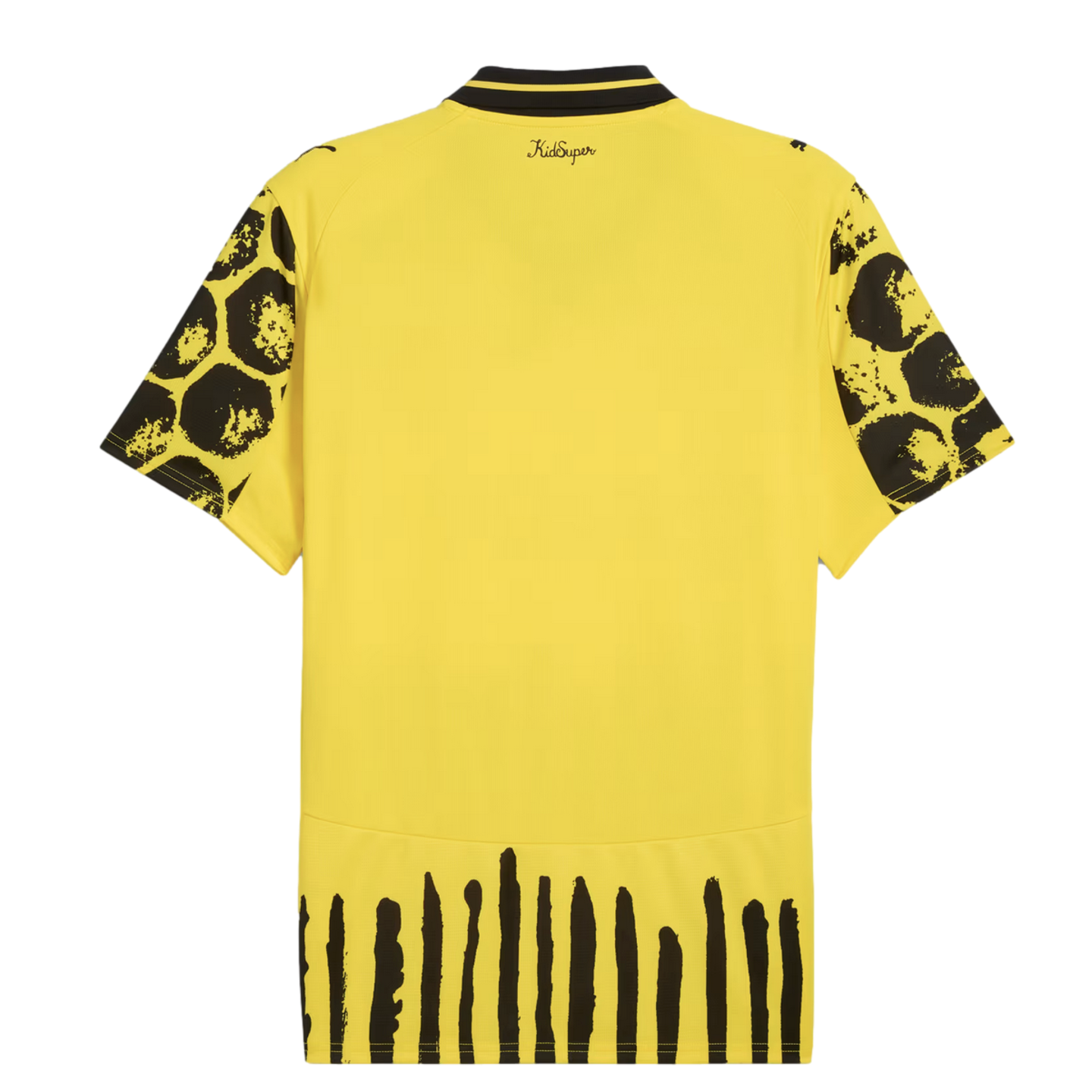 Back of a yellow jersey featuring black-patterned sleeves, vertical stripes at the hem, and 'KidSuper' text near the collar. Small Puma logos are visible on the shoulders.