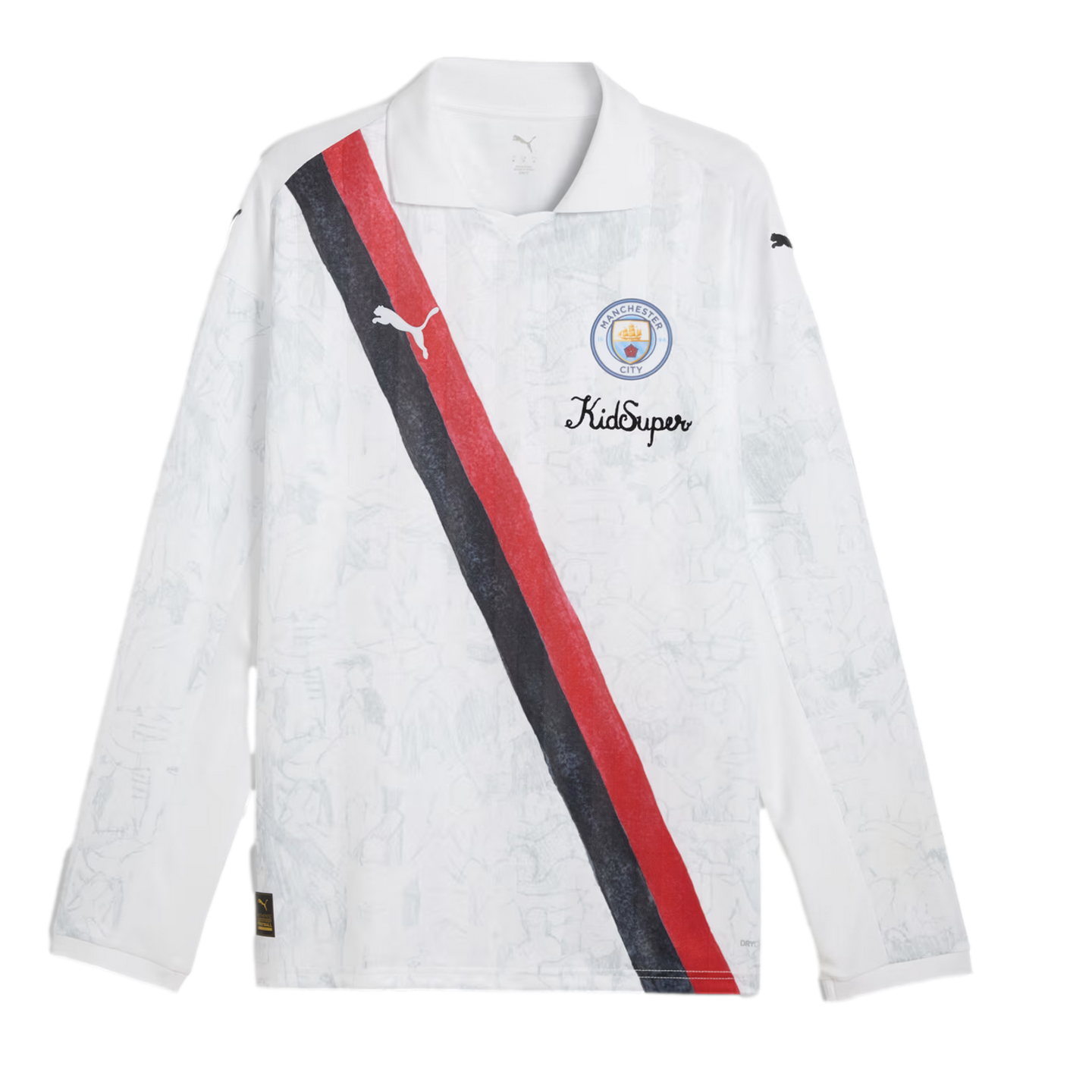 A white long-sleeved Manchester City soccer jersey with a polo collar, featuring a diagonal red and black sash and "KidSuper" branding on the chest.