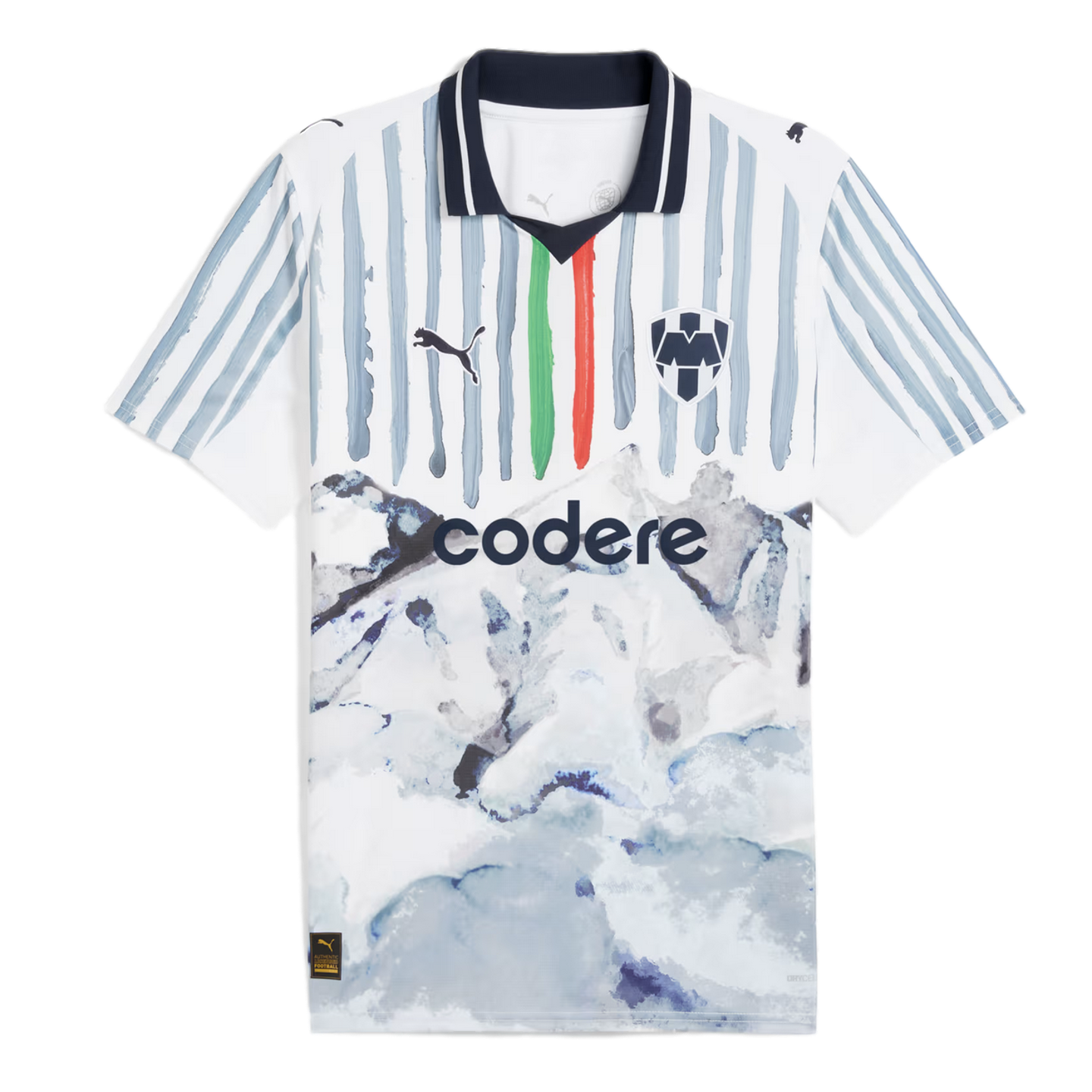White Puma Monterrey soccer jersey featuring grey brushstroke stripes, green and red accents, and a watercolor mountain landscape graphic on the bottom half.