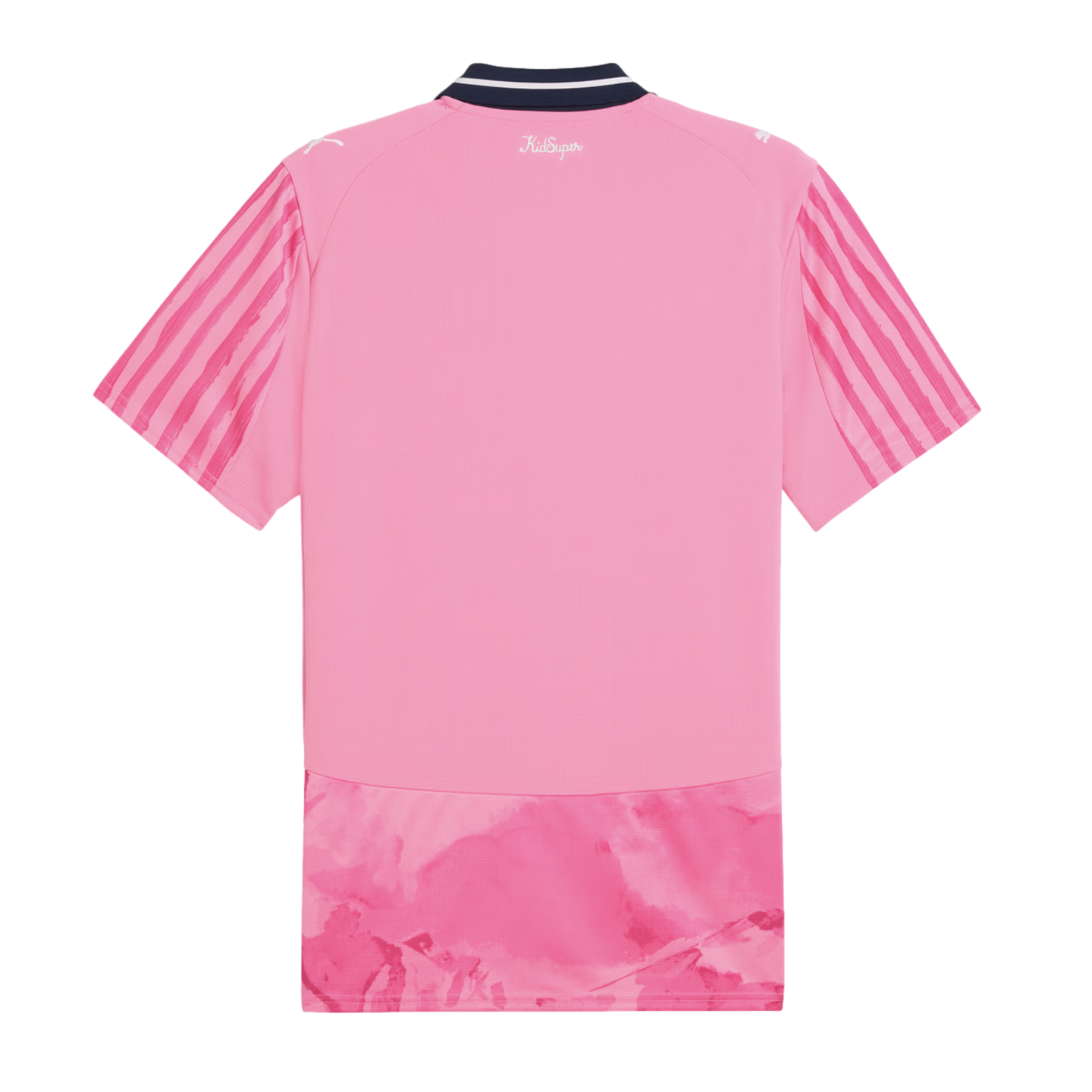 Back view of a pink short-sleeved jersey with a dark blue collar, vertical stripes on sleeves, "KidSuper" text, and a marbled pink pattern at the bottom hem.