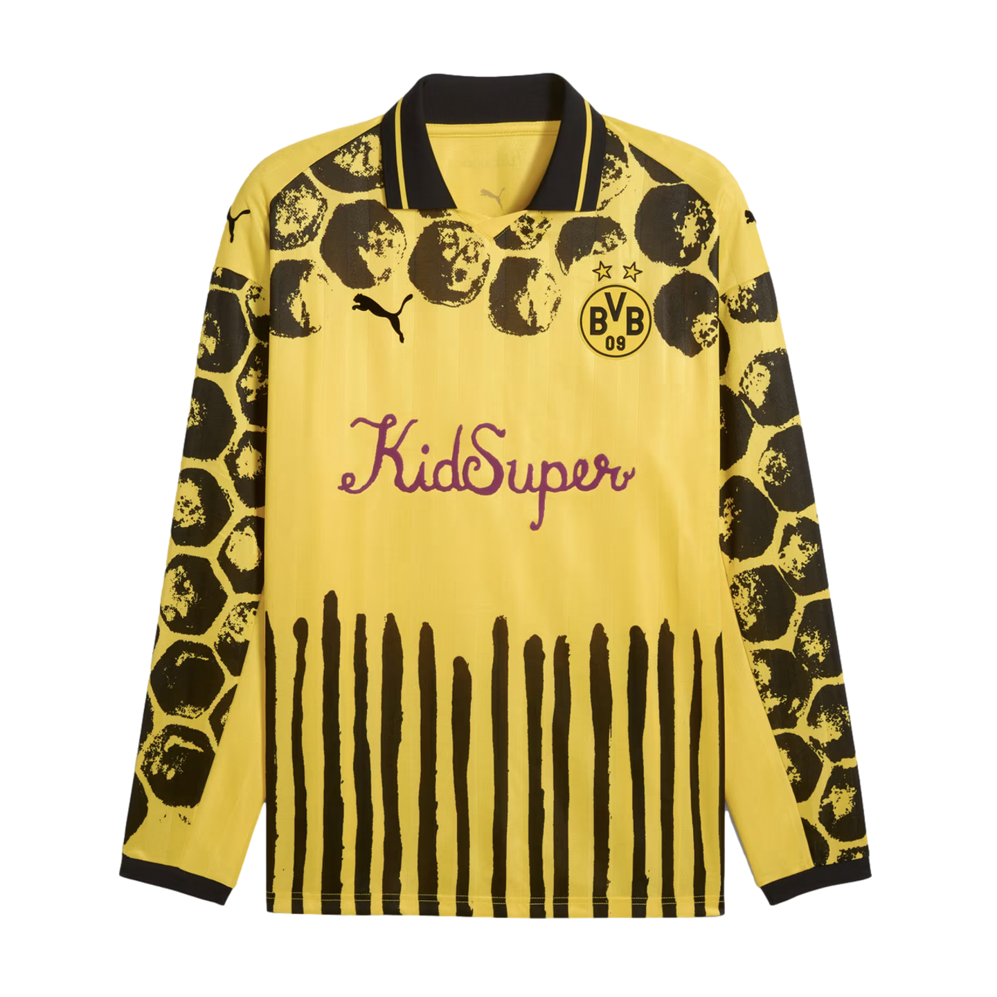 Yellow long-sleeved Puma x KidSuper BVB jersey with black splattered shoulder patterns, vertical black stripes at the hem, and a purple script "KidSuper" logo on the chest.