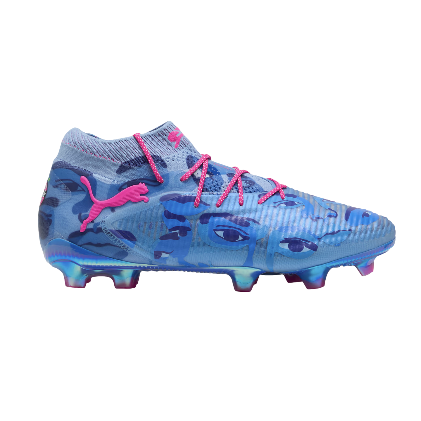 A side view of a blue Puma soccer cleat with pink laces and logo. The upper features a dark blue graphic eye pattern, and the soleplate is iridescent with pink-tipped studs.