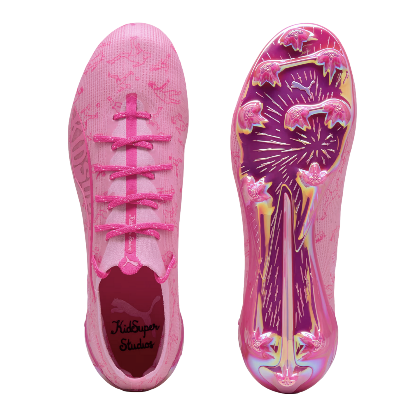 Top and bottom views of pink Puma x KidSuper soccer cleats. Features a patterned upper, branded insole, and iridescent pink/purple sole with traction studs.