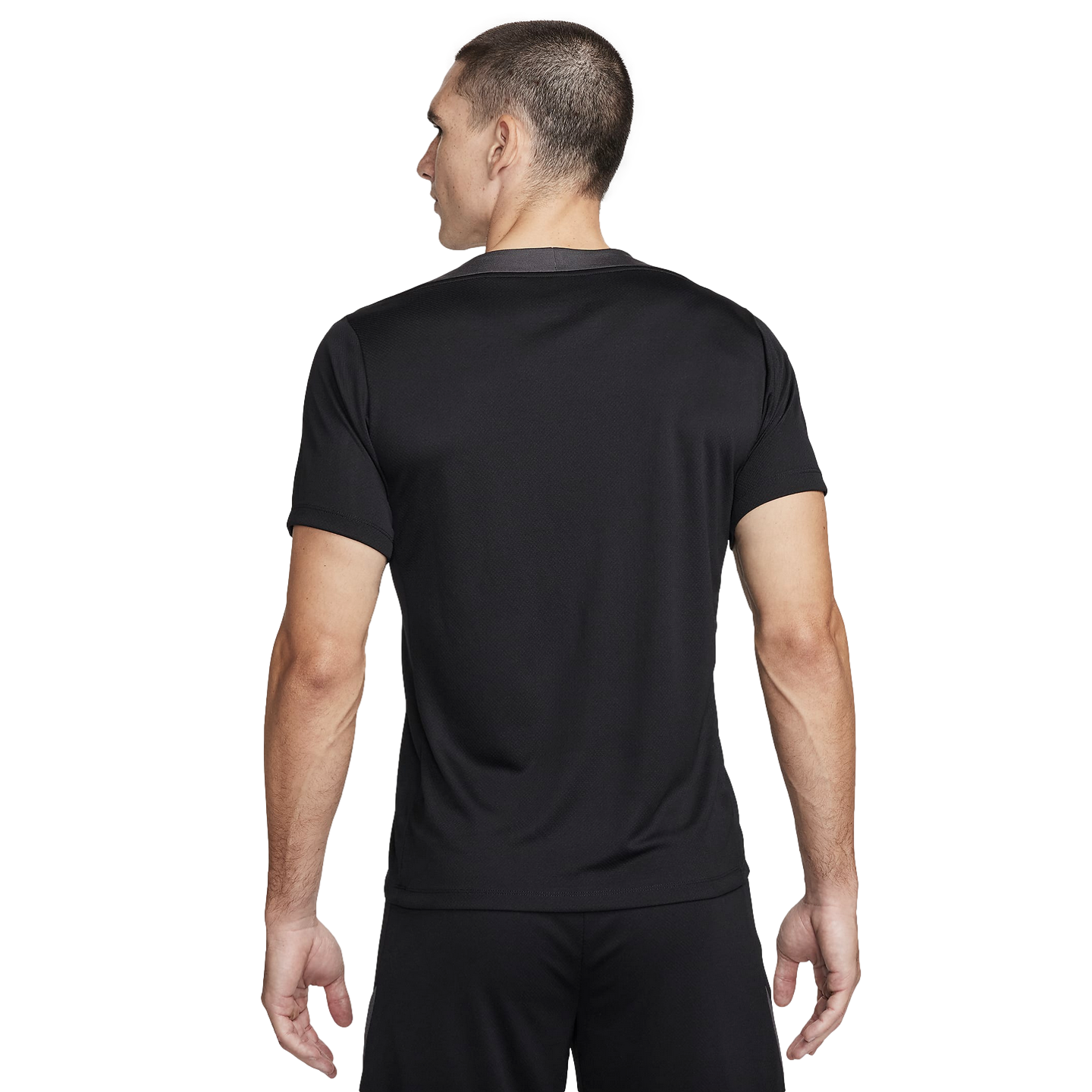 Back view of a man wearing a black short-sleeved athletic t-shirt and matching shorts against a plain white background.