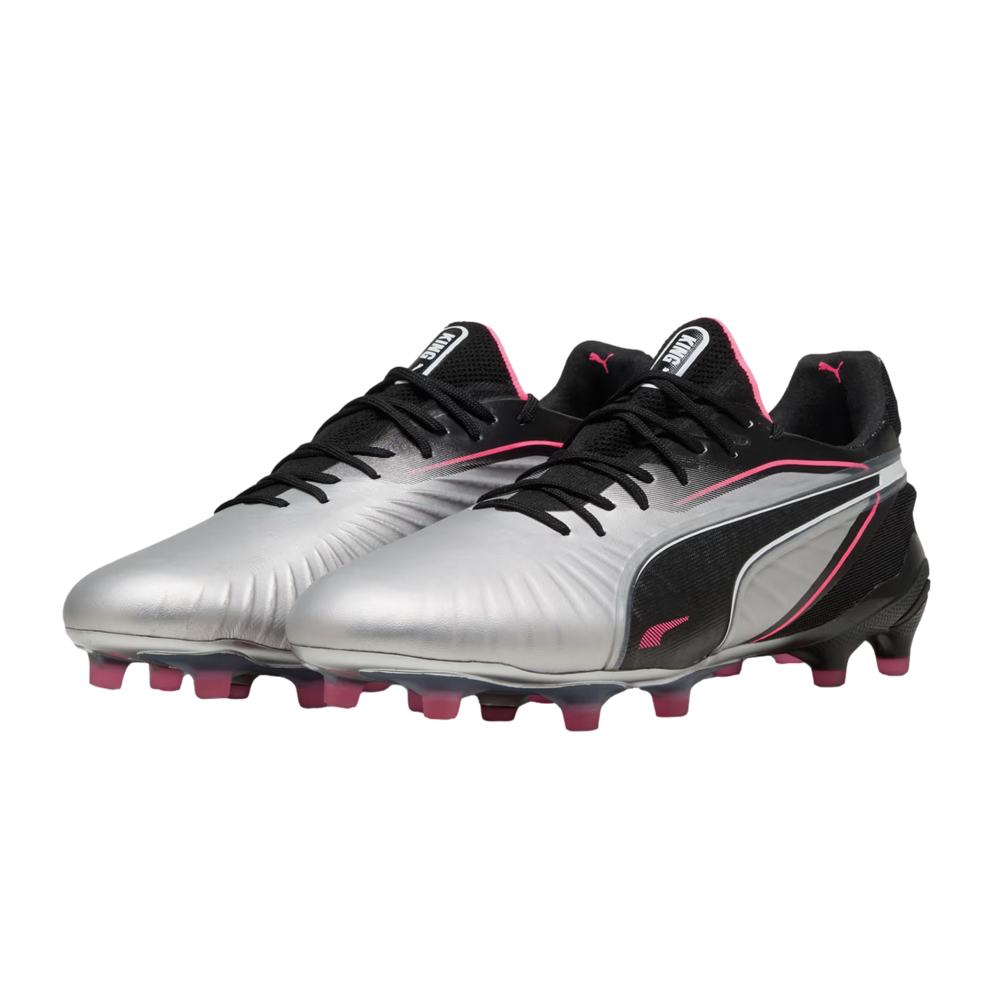 A pair of silver and black Puma King soccer cleats with pink accents on the logos and studs, set against a white background.